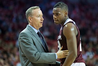 FAYETTEVILLE, AR - JANUARY 27:  Head Coach Billy Kennedy talks with Danuel House #23 of the Texas A&M Aggies during a game against the Arkansas Razorbacks at Bud Walton Arena on January 27, 2016 in Fayetteville, Arkansas.  The Razorbacks defeated the Aggi