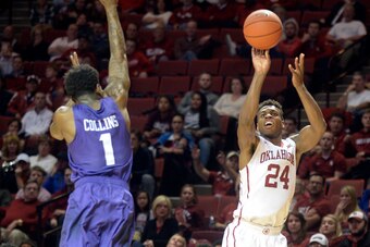 Feb 2, 2016; Norman, OK, USA; Oklahoma Sooners guard Buddy Hield (24) shoots the ball over TCU Horned Frogs guard Chauncey Collins (1) during the second half at Lloyd Noble Center. Mandatory Credit: Mark D. Smith-USA TODAY Sports