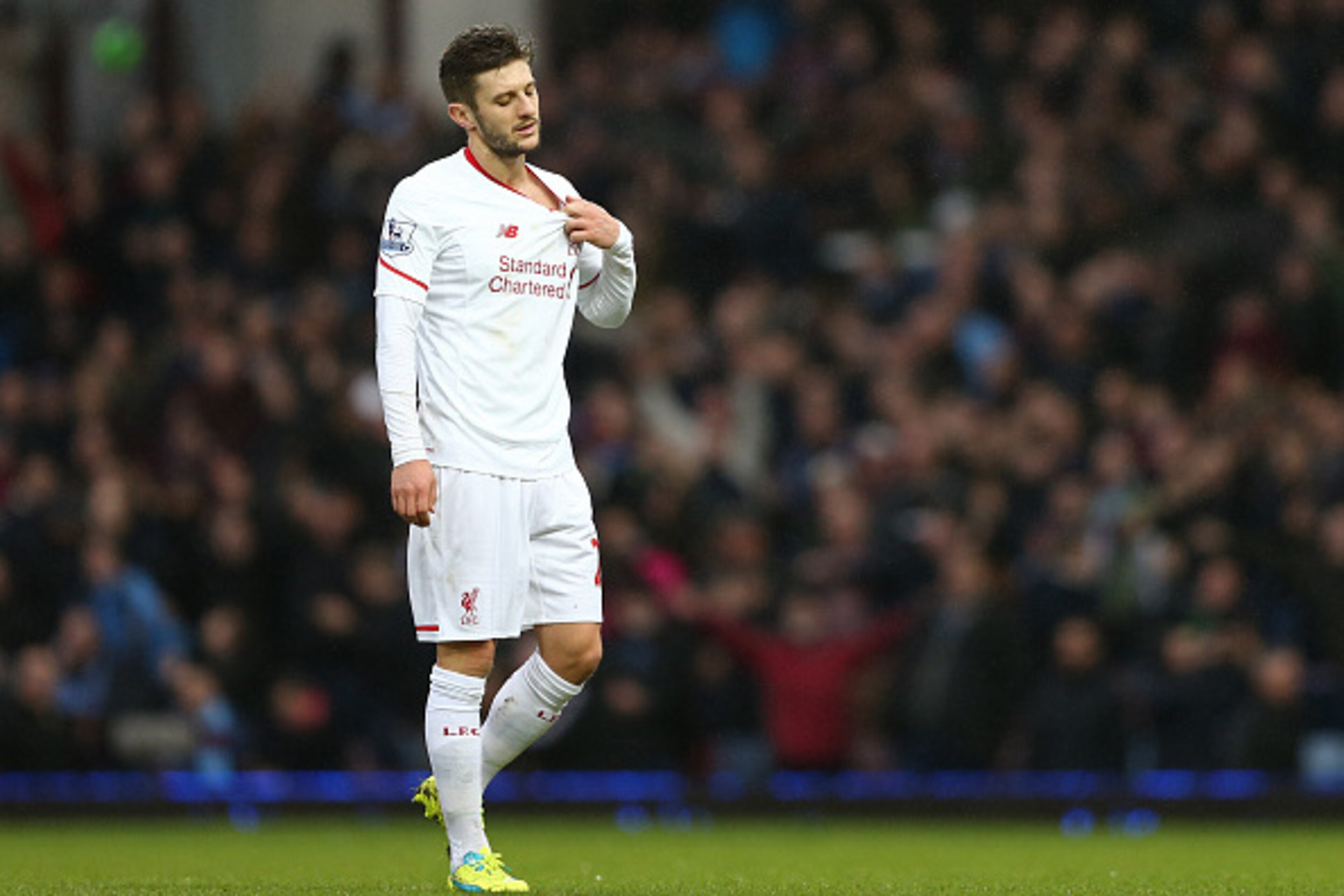 Liverpool's English midfielder Adam Lallana reacts as he leaves the pitch after the English Premier League football match between West Ham United and Liverpool at The Boleyn Ground in Upton Park, East London on January 2, 2016. West Ham won the game 2-0. 