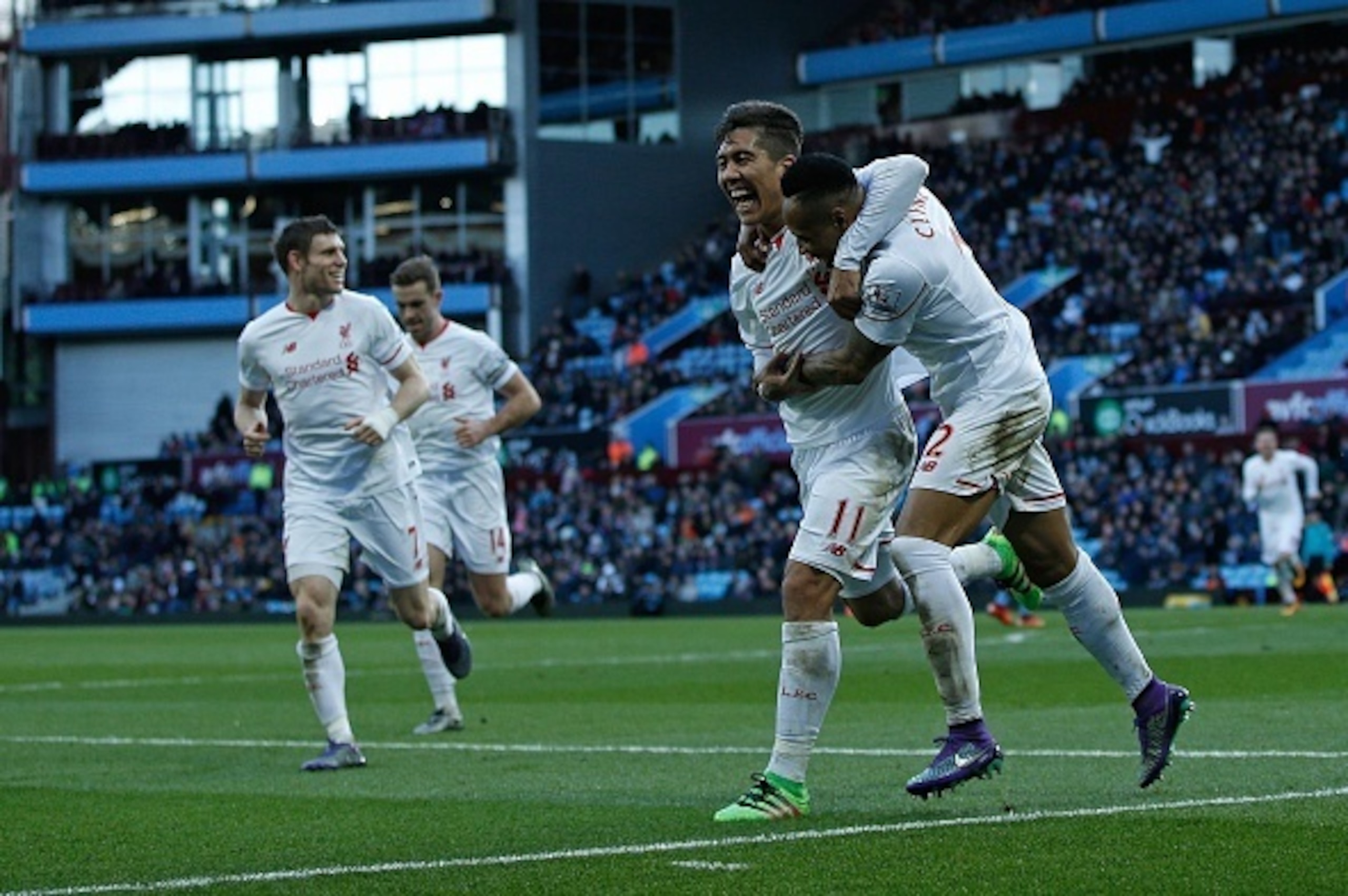 Liverpool's English defender Nathaniel Clyne (R) celebrates scoring his team's fifth goal with Liverpool's Brazilian midfielder Roberto Firmino (2R) and Liverpool's English midfielder James Milner (L) during the English Premier League football match betwe Liverpool's English defender Nathaniel Clyne (R) celebrates scoring his team's fifth goal with Liverpool's Brazilian midfielder Roberto Firmino (2R) and Liverpool's English midfielder James Milner (L) during the English Premier League football match betwe