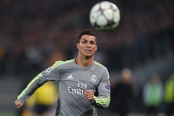 Real Madrid's Portuguese forward Cristiano Ronaldo eyes the ball during the UEFA Champions League football match AS Roma vs Real Madrid on Frebruary 17, 2016 at the Olympic stadium in Rome.   AFP PHOTO / ALBERTO PIZZOLI / AFP / ALBERTO PIZZOLI        (Pho