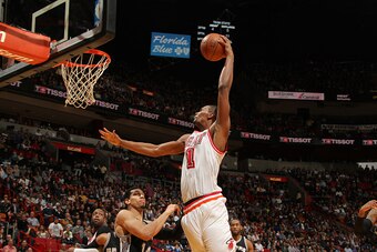 MIAMI, FL - FEBRUARY 9:  Chris Bosh #1 of the Miami Heat goes up for a dunk against the San Antonio Spurs on February 9, 2016 at American Airlines Arena in Miami, Florida. NOTE TO USER: User expressly acknowledges and agrees that, by downloading and or us