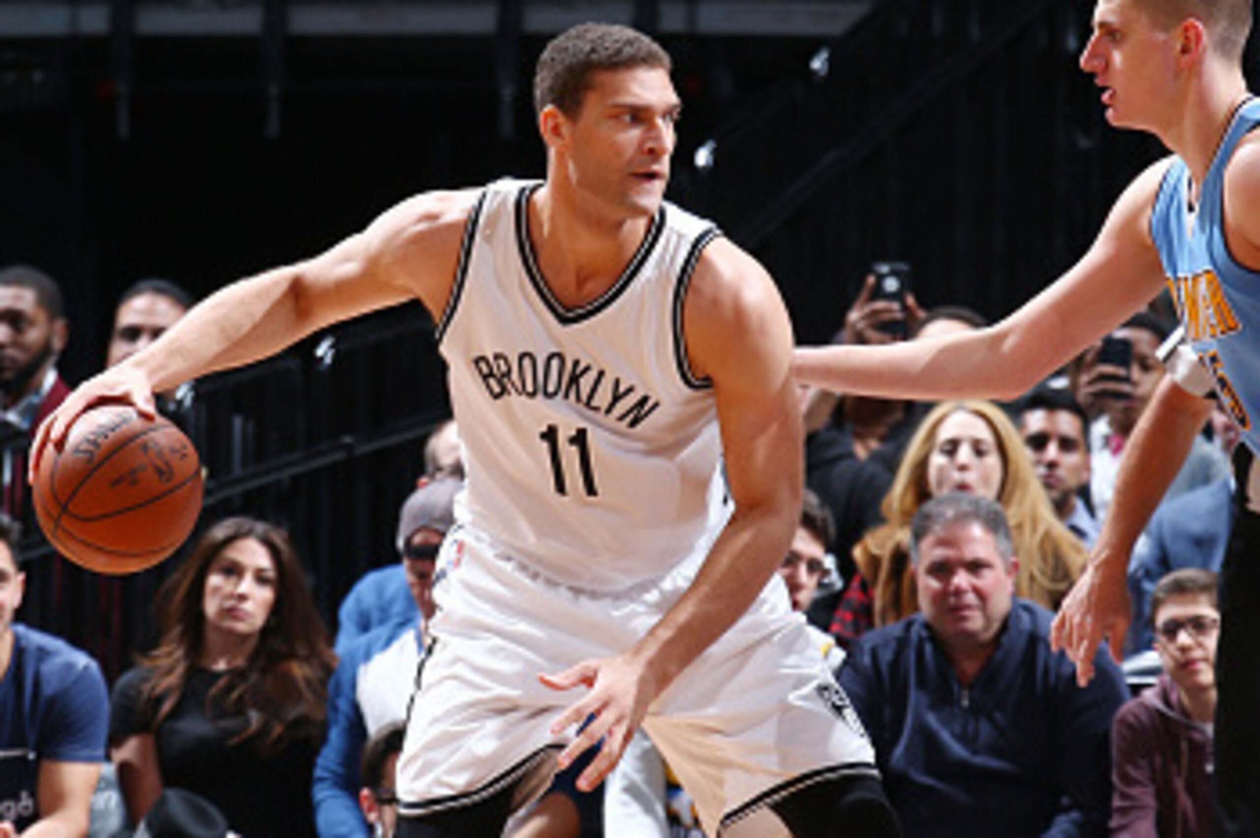 BROOKLYN, NY - FEBRUARY 8: Brook Lopez #11 of the Brooklyn Nets defends the ball against the Denver Nuggets during the game on February 8, 2016 at Barclays Center in Brooklyn, New York. NOTE TO USER: User expressly acknowledges and agrees that, by downloa