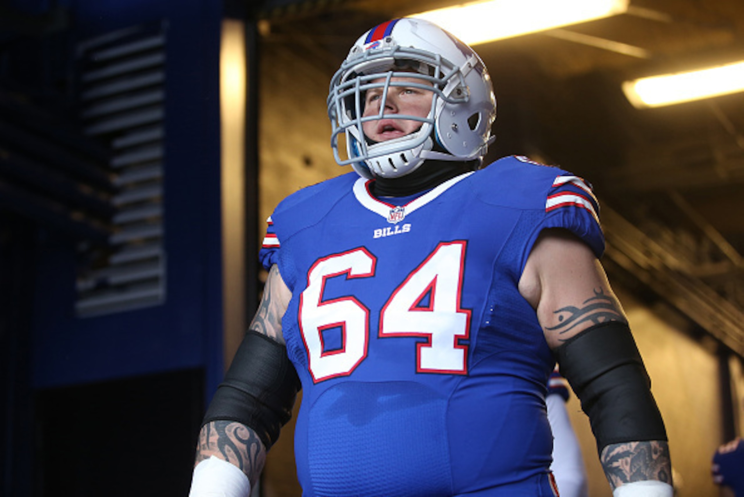 ORCHARD PARK, NY - JANUARY 3: Richie Incognito #64 of the Buffalo Bills walks out onto the field through the tunnel before the start of the game against the New York Jets during NFL game action at Ralph Wilson Stadium on January 3, 2016 in Orchard Park, N