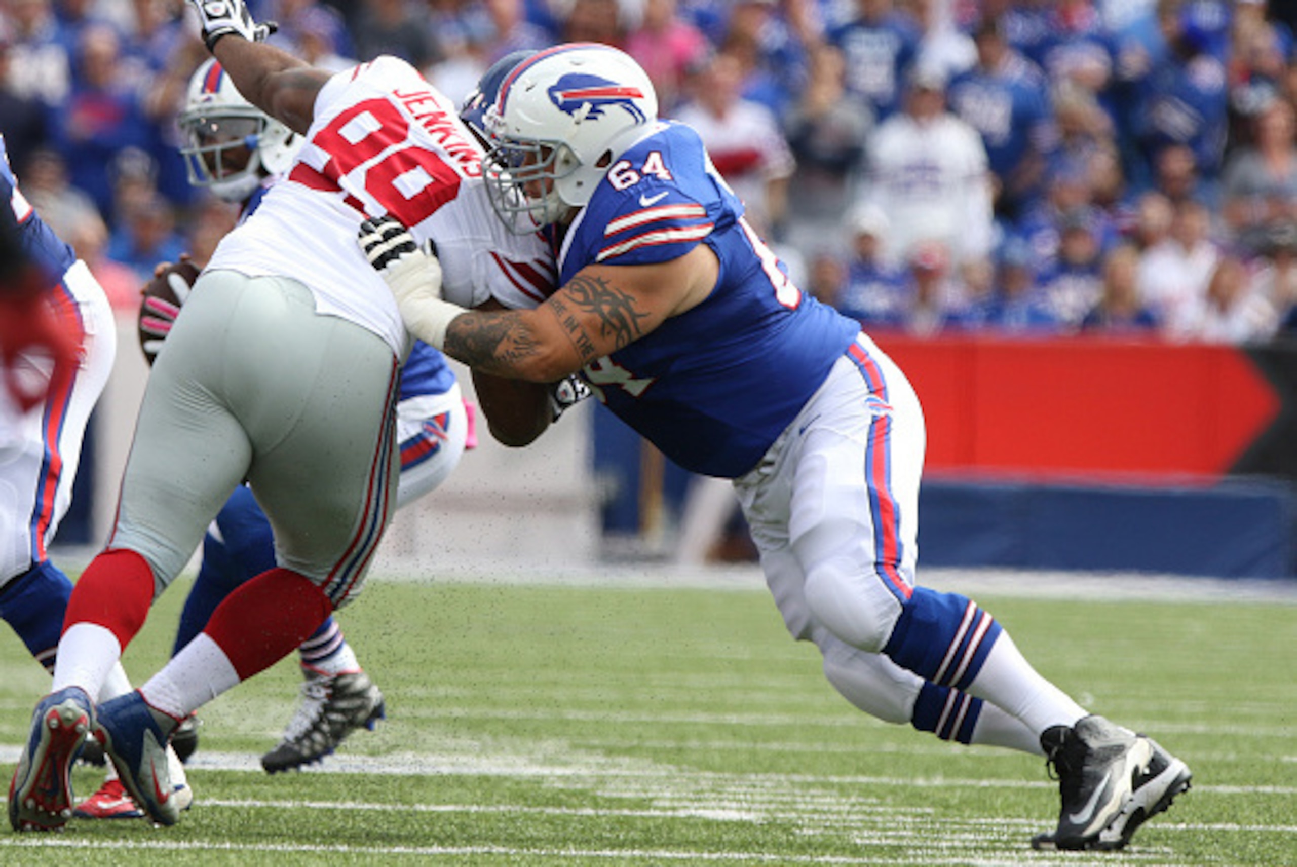 ORCHARD PARK, NY - OCTOBER 04: Richie Incognito #64 of the Buffalo Bills blocks Cullen Jenkins #99 of the New York Giants during the first half at Ralph Wilson Stadium on October 04, 2015 in Orchard Park, New York. (Photo by Jerome Davis/Getty Images)