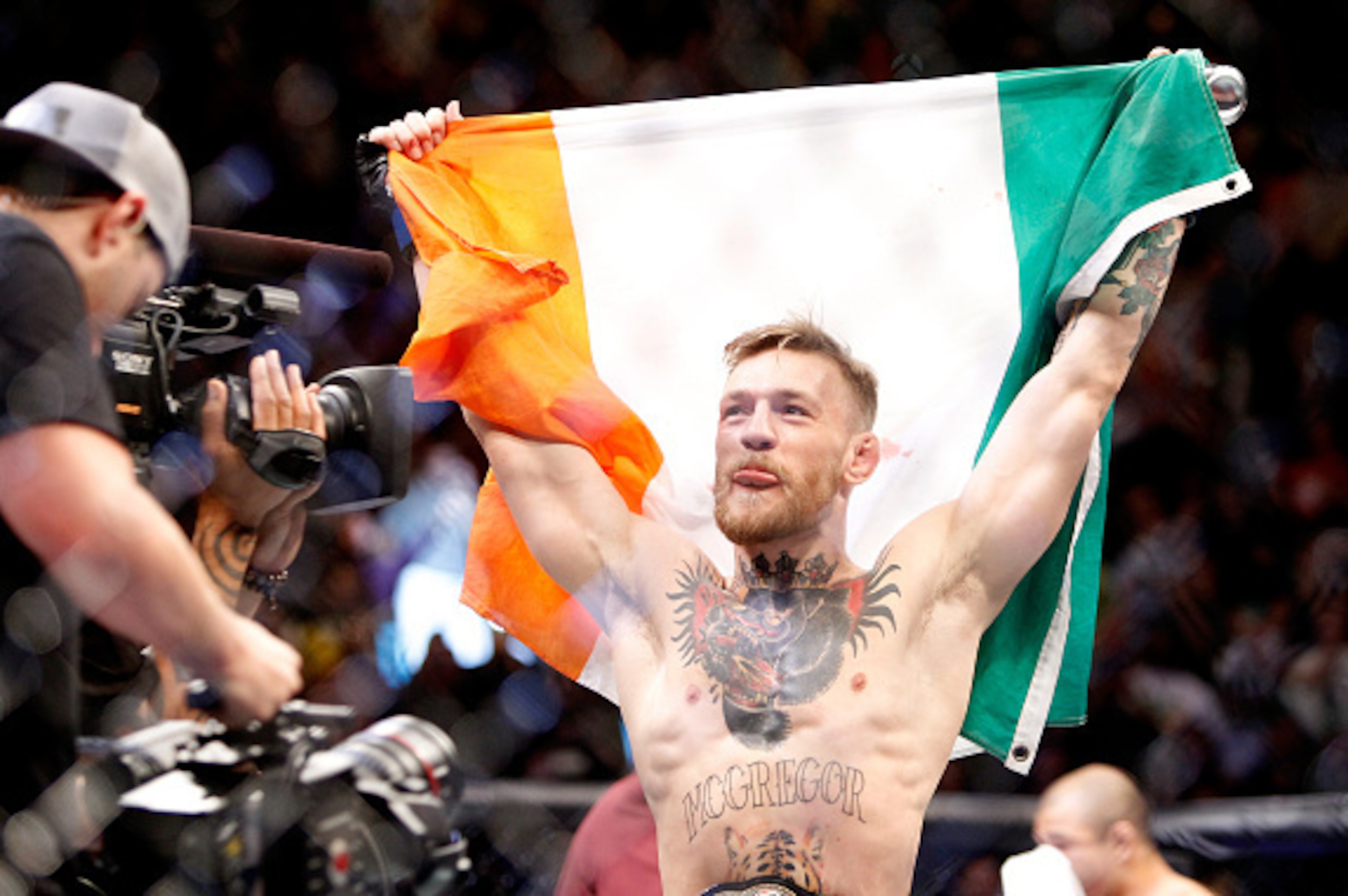 LAS VEGAS, NV - DECEMBER 12:  Conor McGregor celebrates after a first-round knockout victory over Jose Aldo in their featherweight title fight during UFC 194 at MGM Grand Garden Arena on December 12, 2015 in Las Vegas, Nevada.  (Photo by Steve Marcus/Gett