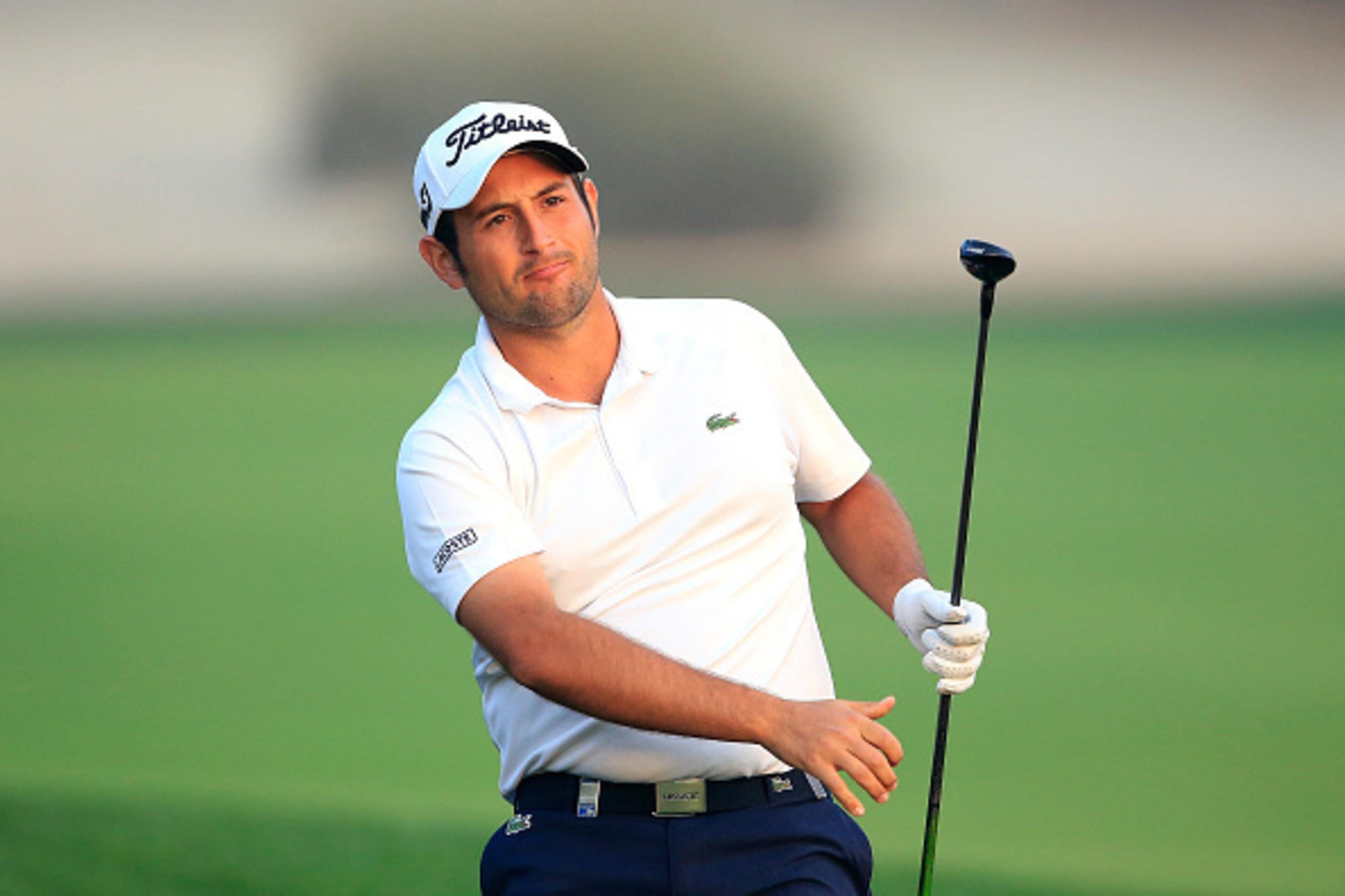 DUBAI, UNITED ARAB EMIRATES - FEBRUARY 04: Alexander Levy of France plays his second shot on the par 5, 10th hole during the first round of the 2016 Omega Dubai Desert Classic on the Majlis Course at the Emirates Golf Club on February 4, 2016 in Dubai, U DUBAI, UNITED ARAB EMIRATES - FEBRUARY 04: Alexander Levy of France plays his second shot on the par 5, 10th hole during the first round of the 2016 Omega Dubai Desert Classic on the Majlis Course at the Emirates Golf Club on February 4, 2016 in Dubai, U