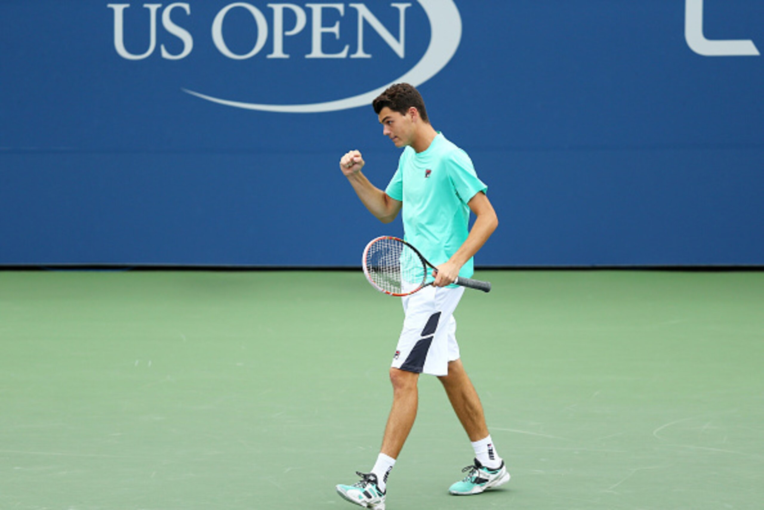 NEW YORK, NY - SEPTEMBER 13: Taylor Fritz of the United States returns a shot to Tommy Paul of the United States during their Junior Boys' Singles Final match on Day Fourteen of the 2015 US Open at the USTA Billie Jean King National Tennis Center on Sept NEW YORK, NY - SEPTEMBER 13: Taylor Fritz of the United States returns a shot to Tommy Paul of the United States during their Junior Boys' Singles Final match on Day Fourteen of the 2015 US Open at the USTA Billie Jean King National Tennis Center on Sept