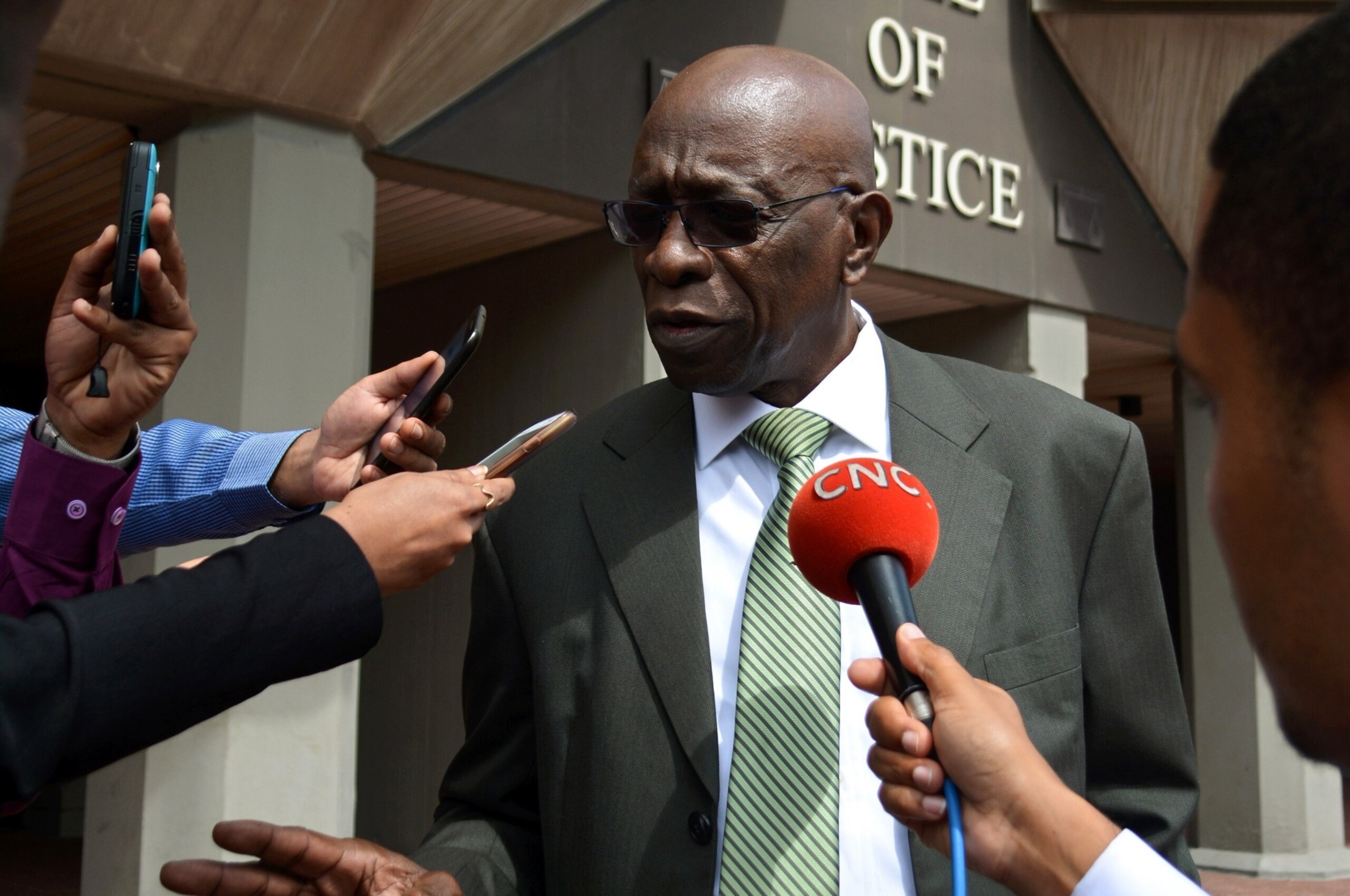 Former FIFA vice-president Jack Warner talks with journalists outside the Hall of Justice in Port-of-Spain, Trinidad, on December 4, 2015, following the hearing of his legal challenge to avert being extradited to the United States where he has been indict Former FIFA vice-president Jack Warner talks with journalists outside the Hall of Justice in Port-of-Spain, Trinidad, on December 4, 2015, following the hearing of his legal challenge to avert being extradited to the United States where he has been indict