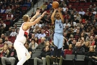 Jan 4, 2016; Portland, OR, USA; Memphis Grizzlies guard Courtney Lee (5) shoots over Portland Trail Blazers center Mason Plumlee (24) at Moda Center at the Rose Quarter. Mandatory Credit: Jaime Valdez-USA TODAY Sports