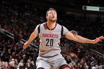 HOUSTON, TX - DECEMBER 19:  Donatas Motiejunas #20 of the Houston Rockets boxes out against the Los Angeles Clippers on December 19, 2015 at the Toyota Center in Houston, Texas. NOTE TO USER: User expressly acknowledges and agrees that, by downloading and