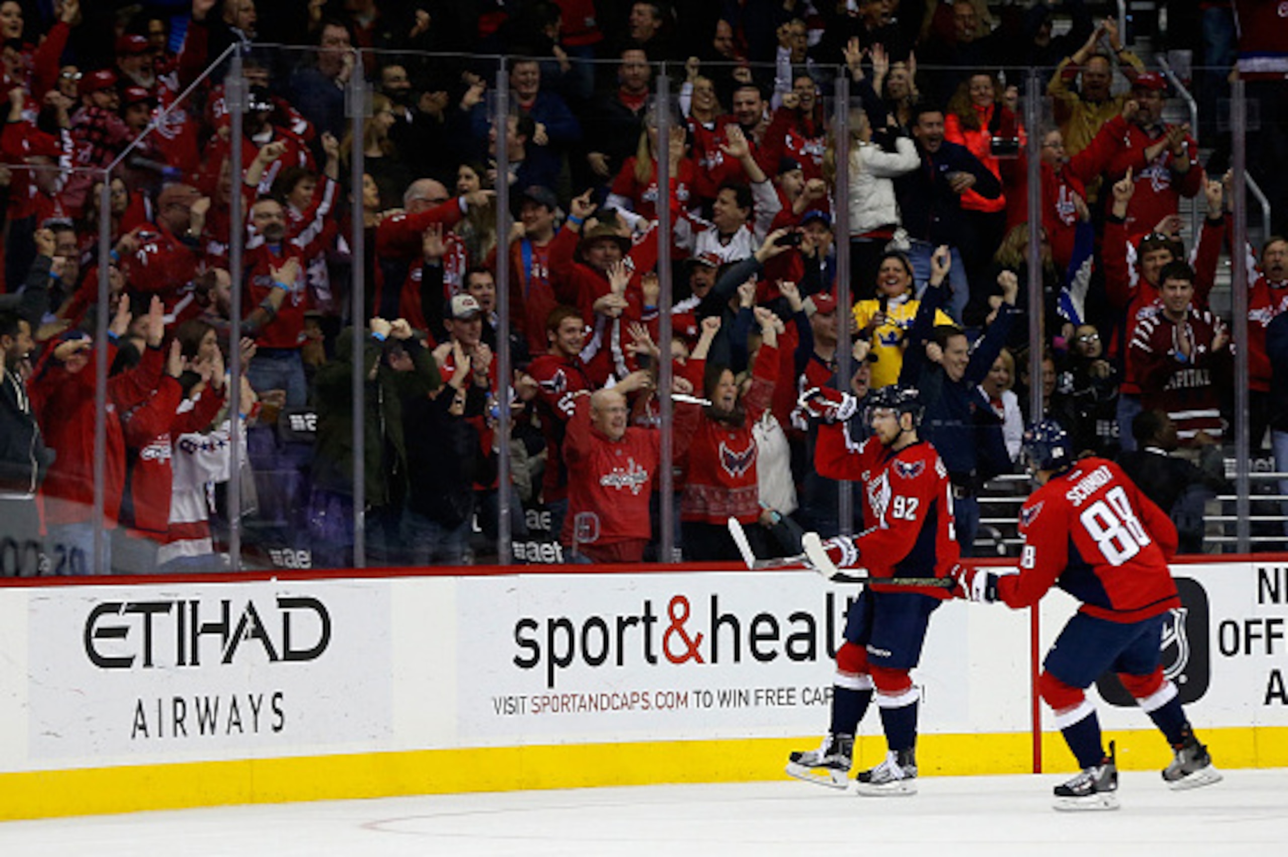 WASHINGTON, DC - FEBRUARY 16: Nate Schmidt #88 looks on as teammate Evgeny Kuznetsov #92 of the Washington Capitals celebrates after scoring a third period goal against the Los Angeles Kings during their 3-1 win at Verizon Center on February 16, 2016 in W WASHINGTON, DC - FEBRUARY 16: Nate Schmidt #88 looks on as teammate Evgeny Kuznetsov #92 of the Washington Capitals celebrates after scoring a third period goal against the Los Angeles Kings during their 3-1 win at Verizon Center on February 16, 2016 in W