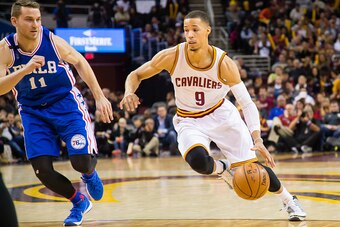 CLEVELAND, OH - DECEMBER 20: Nik Stauskas #11 of the Philadelphia 76ers tries to guard Jared Cunningham #9 of the Cleveland Cavaliers during the second half at Quicken Loans Arena on December 20, 2015 in Cleveland, Ohio. The Cavaliers defeated the 76ers 1