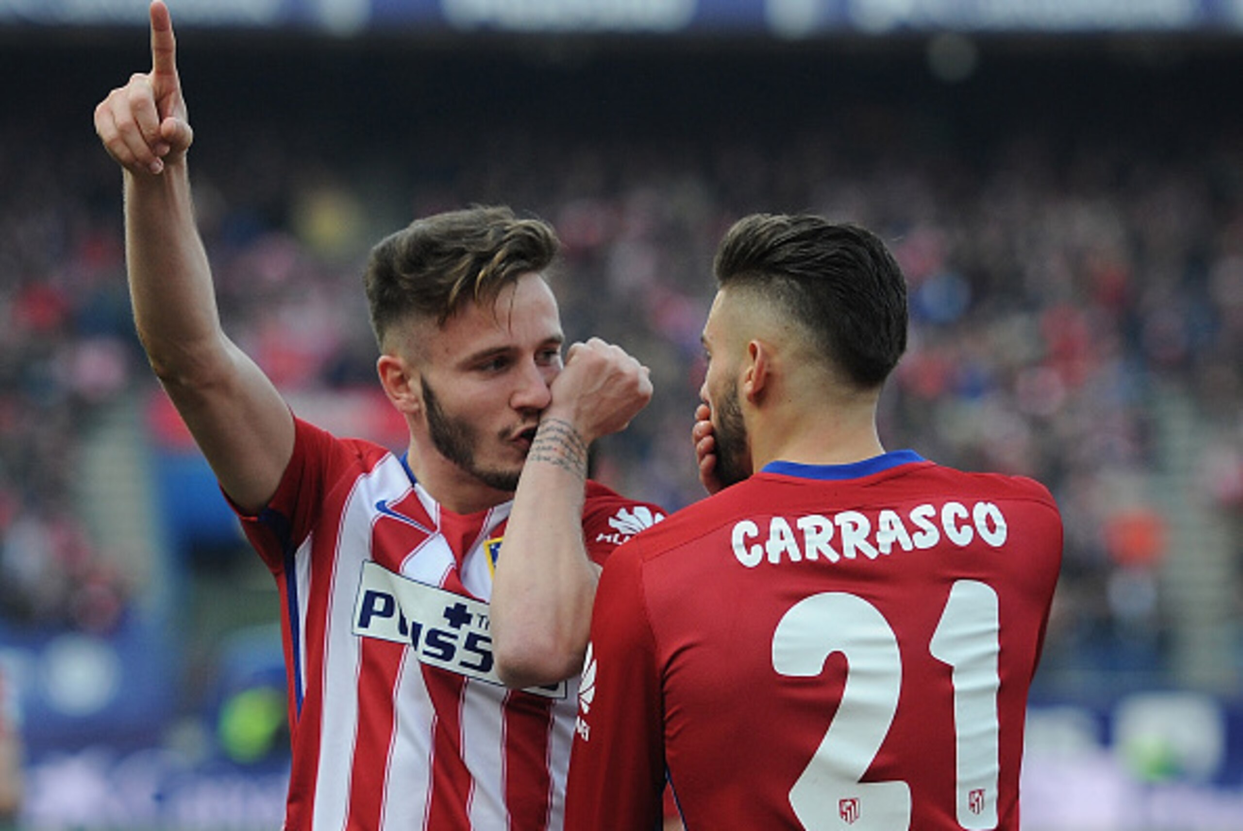 MADRID, SPAIN - FEBRUARY 06:  Saul Niguez of Club Atletico de Madrid celebrates with Yannick Carrasco after scoring his team's 2nd goal during the La Liga match between Club Atletico de Madrid and SD Eibar at Vicente Calderon Stadium on February 6, 2016 i