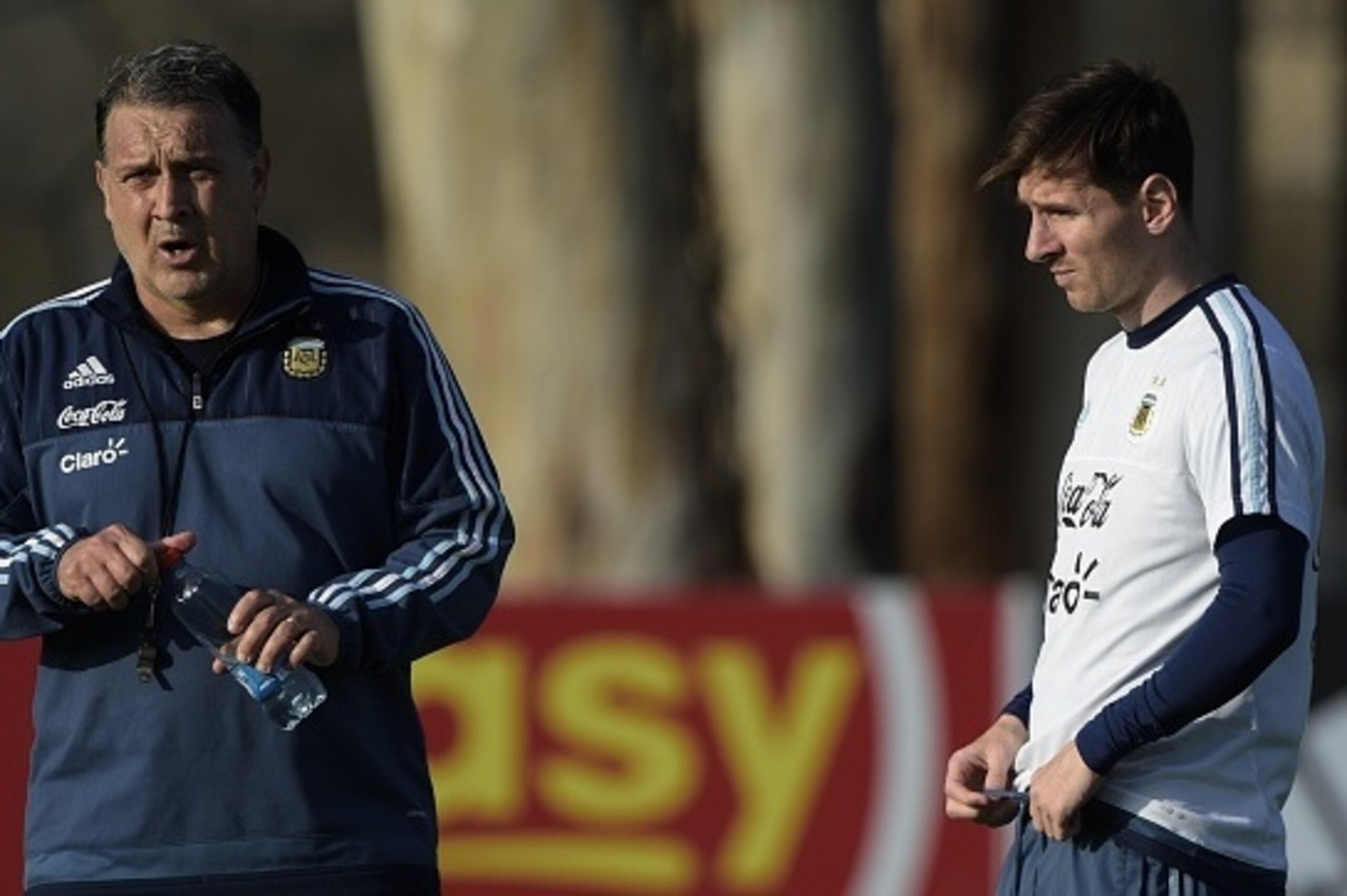 Argentina's forward Lionel Messi (R) listens to coach Gerardo Martino during a training session in La Serena, Coquimbo, Chile, on June 23, 2015 ahead the Copa America quarterfinal football match against Colombia to be held in Vina del Mar on June 26. AFP 