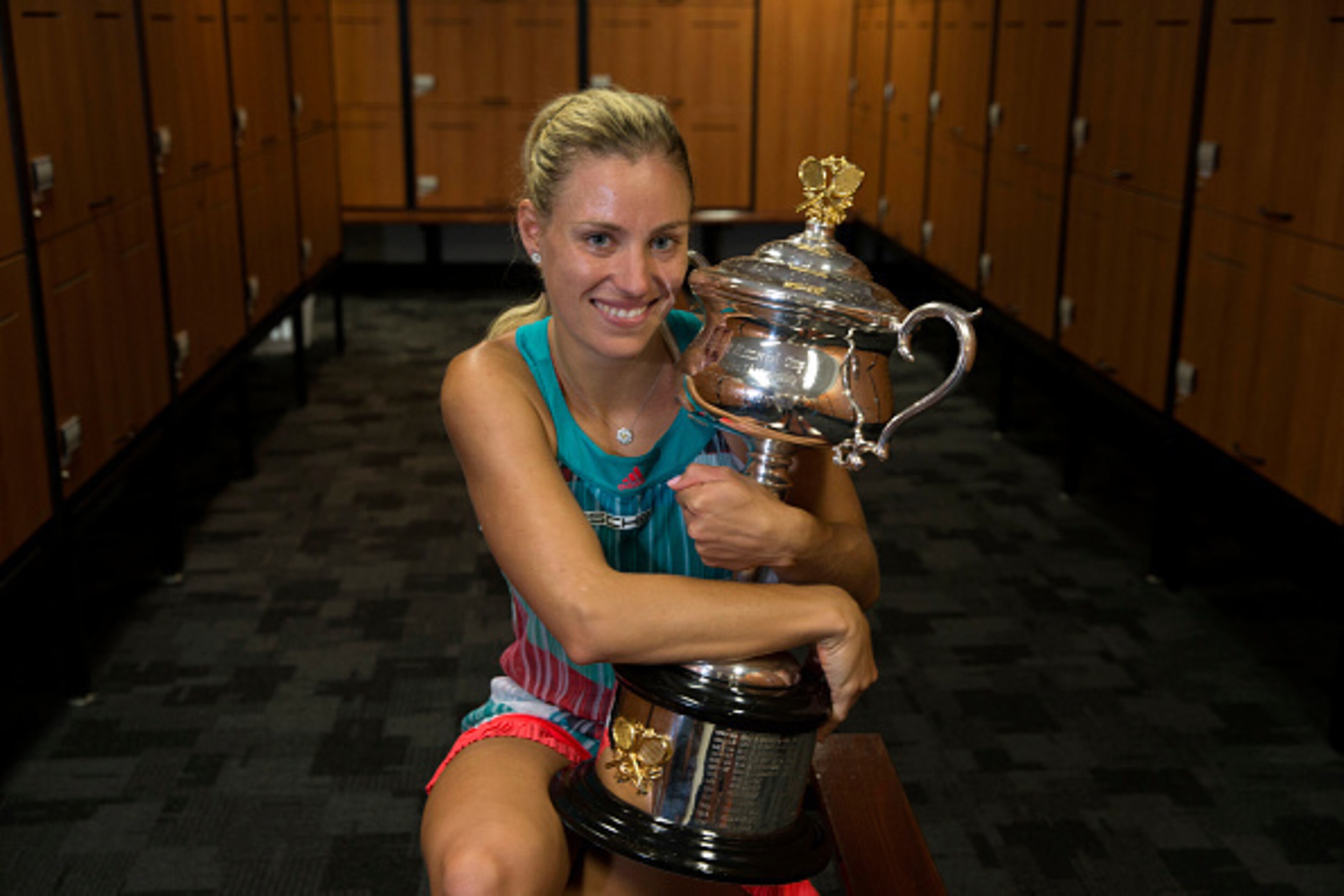MELBOURNE, VICTORIA - JANUARY 30: In this handout photo provided by Tennis Australia, Angelique Kerber of Germany poses with the Daphne Akhurst Trophy in the players change rooms after winning her Women's Singles Final match against Serena Williams of th MELBOURNE, VICTORIA - JANUARY 30: In this handout photo provided by Tennis Australia, Angelique Kerber of Germany poses with the Daphne Akhurst Trophy in the players change rooms after winning her Women's Singles Final match against Serena Williams of th