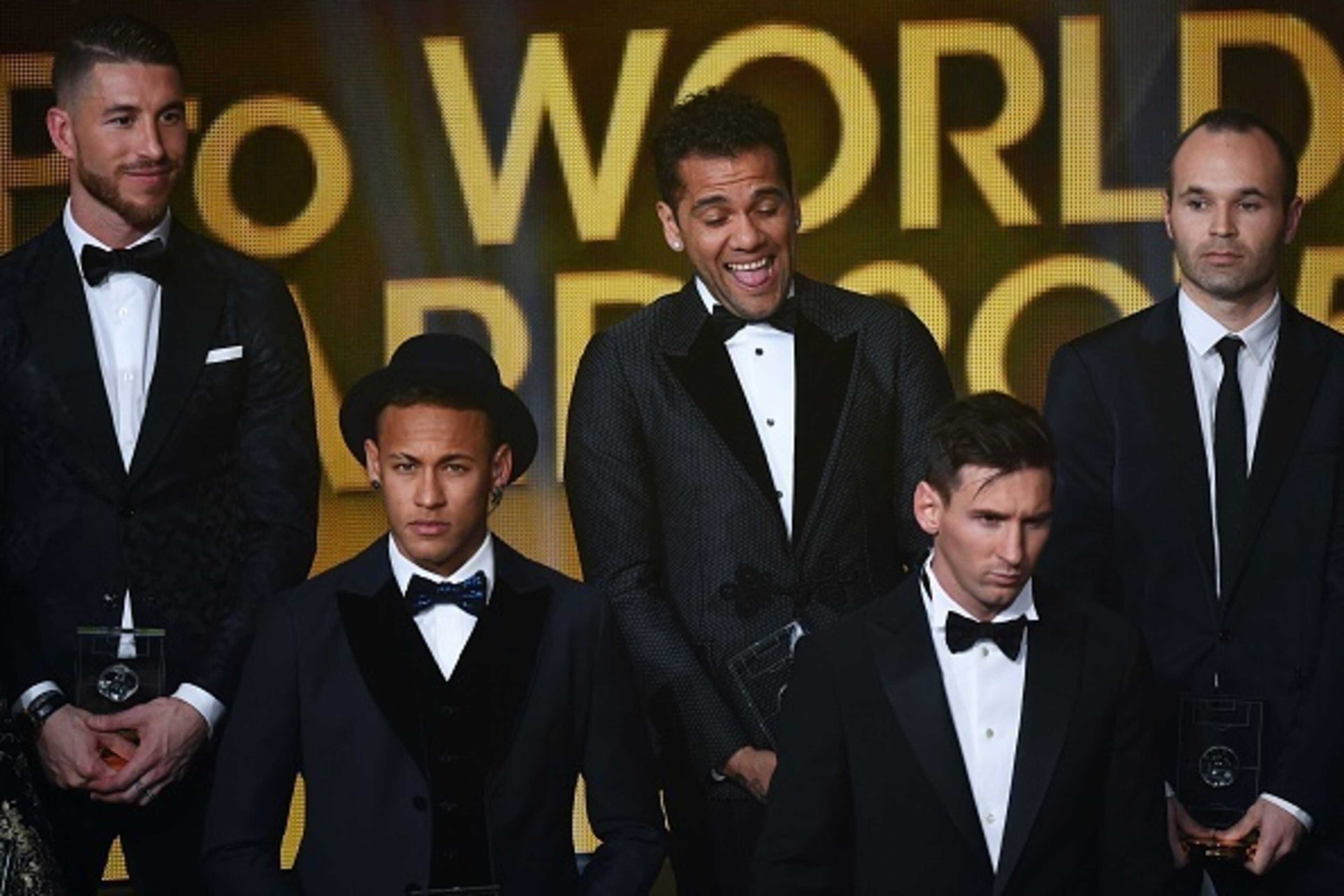 TOPSHOT - (From L) Spain and Real Madrid defender Sergio Ramos, Brazil and FC Barcelona forward Neymar, Brazil and FC Barcelona defender Dani Alves, Argentina and FC Barcelona forward Lionel Messi and Spain and FC Barcelona midfielder Andres Iniesta pose 