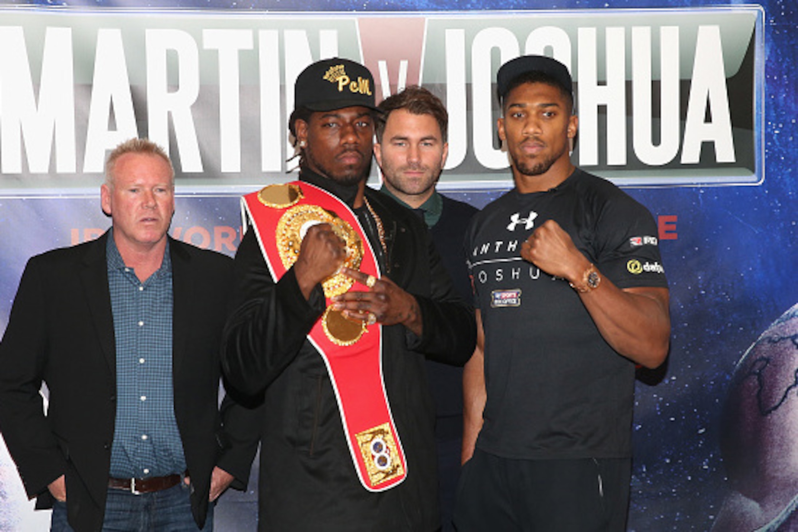LONDON, ENGLAND - FEBRUARY 19:  (L-R) Paul Cain (Martin's trainer), Charles Martin of the USA, promoter Eddie Hearn and Anthony Joshua of England are pictured together during the Anthony Joshua and Charles Martin Press Conference at The Dorchester hotel o