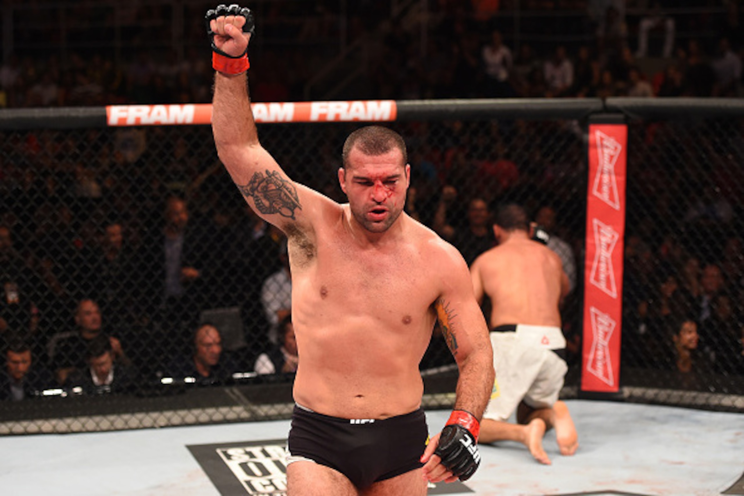 RIO DE JANEIRO, BRAZIL - AUGUST 01:  (L-R) Mauricio 'Shogun' Rua of Brazil celebrates his victory over Rogerio Nogueira of Brazil in their light heavyweight bout during the UFC 190 event inside HSBC Arena on August 1, 2015 in Rio de Janeiro, Brazil.  (Pho