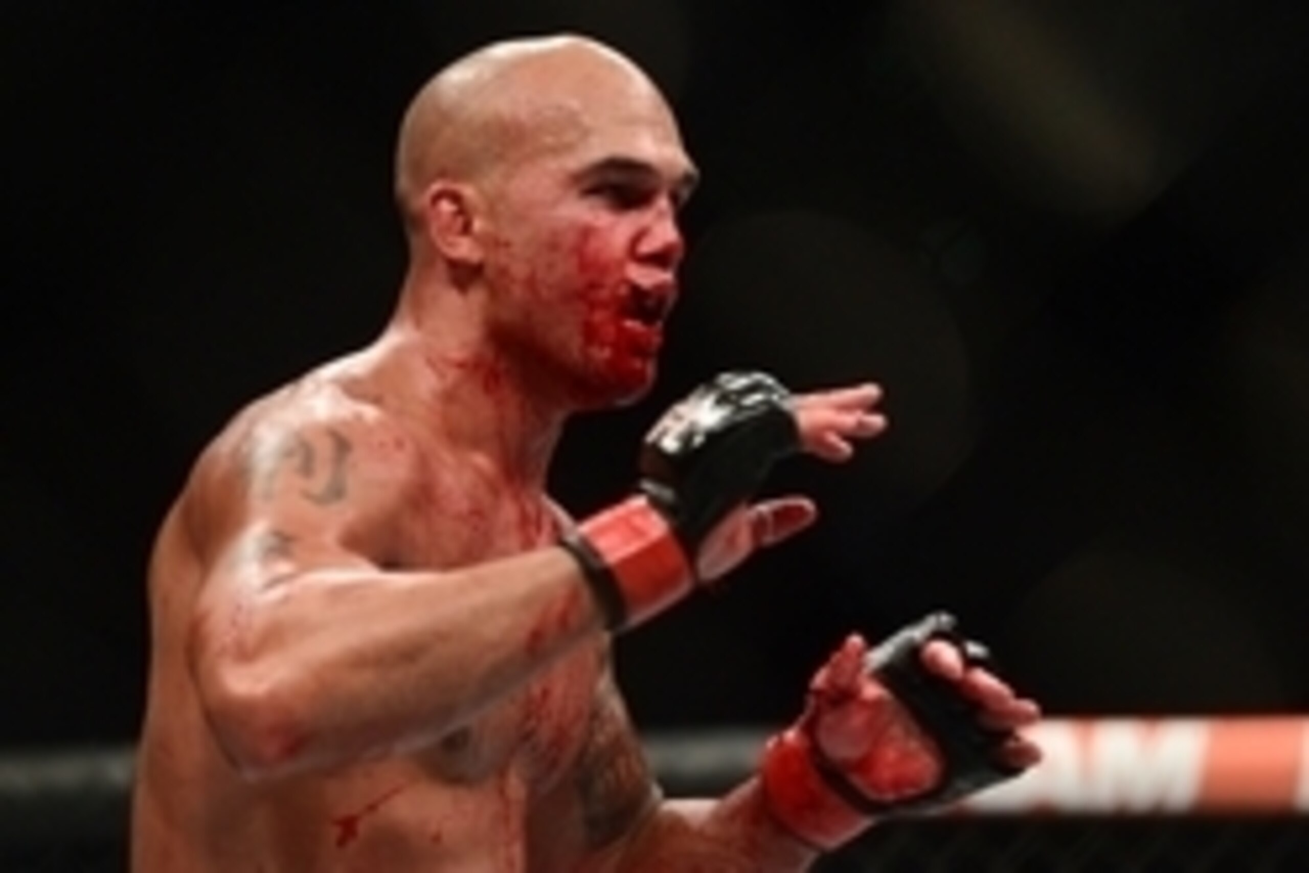 Jul 11, 2015; Las Vegas, NV, USA; Robbie Lawler (red gloves) and Rory MacDonald (not pictured) fight during their welterweight title bout during UFC 189 at MGM Grand Garden Arena. Lawler won via fifth round TKO. Mandatory Credit: Joe Camporeale-USA TODAY 