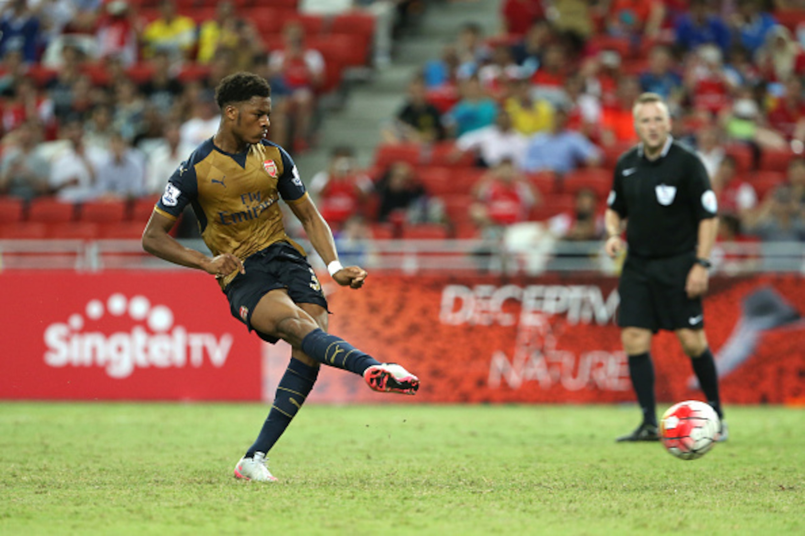 SINGAPORE - JULY 15:  Chuba Akpom of Arsenal scores the third goal from the penalty spot during the Barclays Asia Trophy match between Arsenal and Singapore Select XI at National Stadium on July 15, 2015 in Singapore.  (Photo by Lionel Ng/Getty Images)