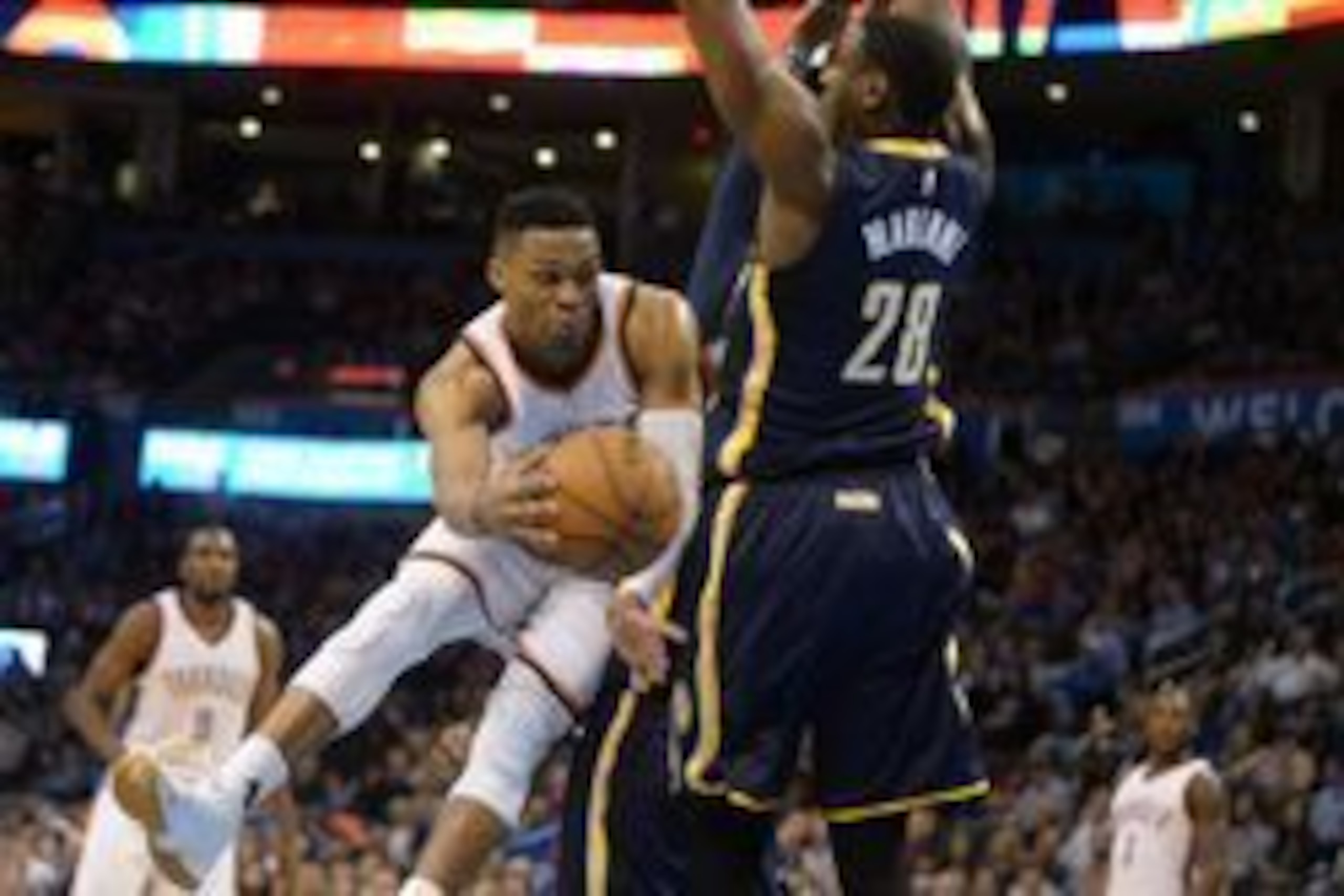 Feb 19, 2016; Oklahoma City, OK, USA; Oklahoma City Thunder guard Russell Westbrook (0) passes the ball behind Indiana Pacers center Ian Mahinmi (28) during the first quarter at Chesapeake Energy Arena. Mandatory Credit: Mark D. Smith-USA TODAY Sports