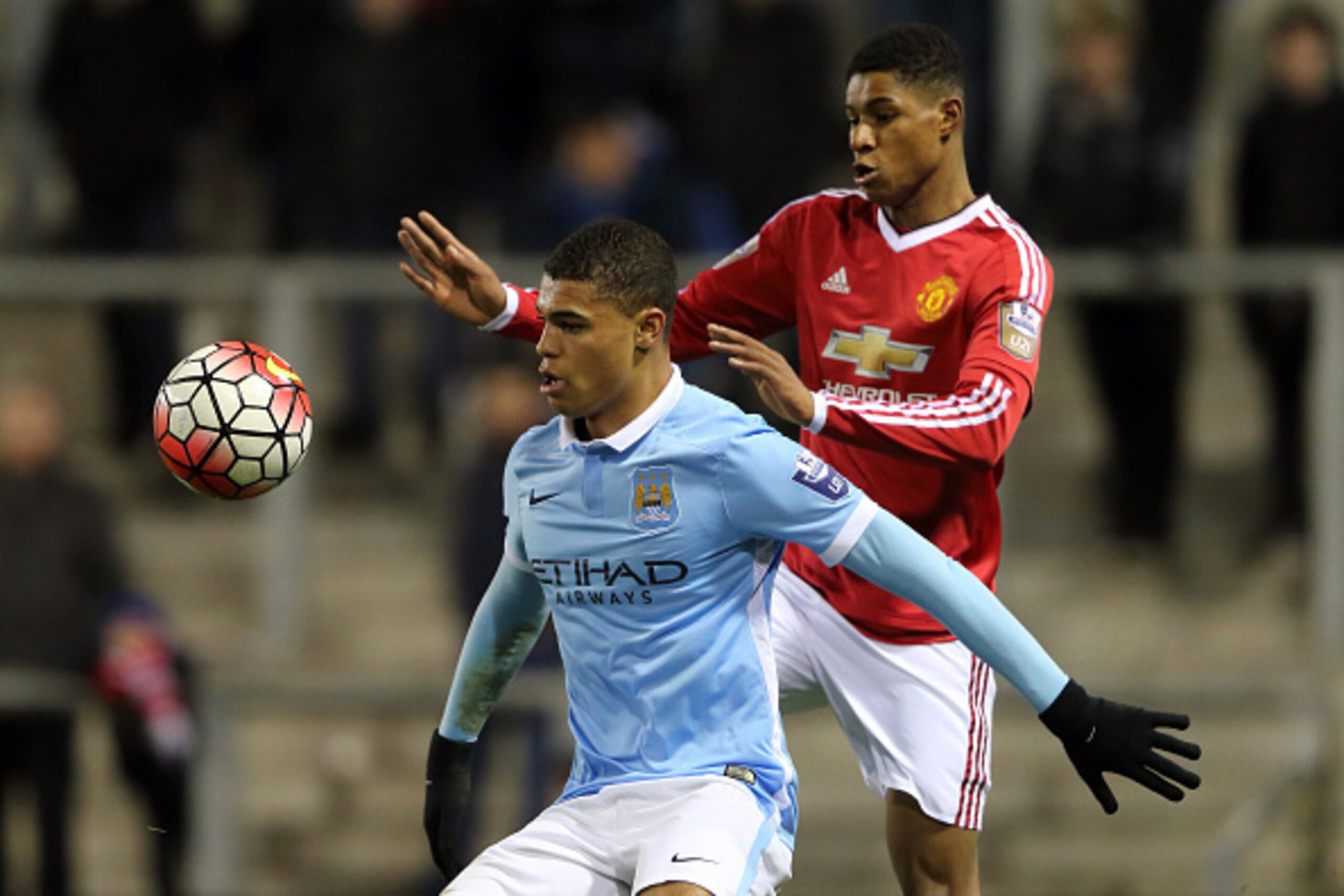 LEIGH, ENGLAND - FEBRUARY 11:  Cameron Humphreys of Manchester City U21 and Marcus Redmond of Manchester United U21 in action during the Barclays Under-21 Premier League Division One match between Manchester United U21 and Manchester City U21 at  Leigh Sp