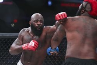 Feb 19, 2016; Houston, TX, USA; Kimbo Slice (red gloves) competes against Dada 5000 (blue gloves) during their Heavyweight fight at Bellator 149 at Toyota Center. Mandatory Credit: Troy Taormina-USA TODAY Sports