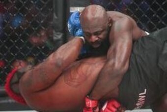 Feb 19, 2016; Houston, TX, USA; Kimbo Slice (red gloves) competes against Dada 5000 (blue gloves) during their Heavyweight fight at Bellator 149 at Toyota Center. Mandatory Credit: Troy Taormina-USA TODAY Sports