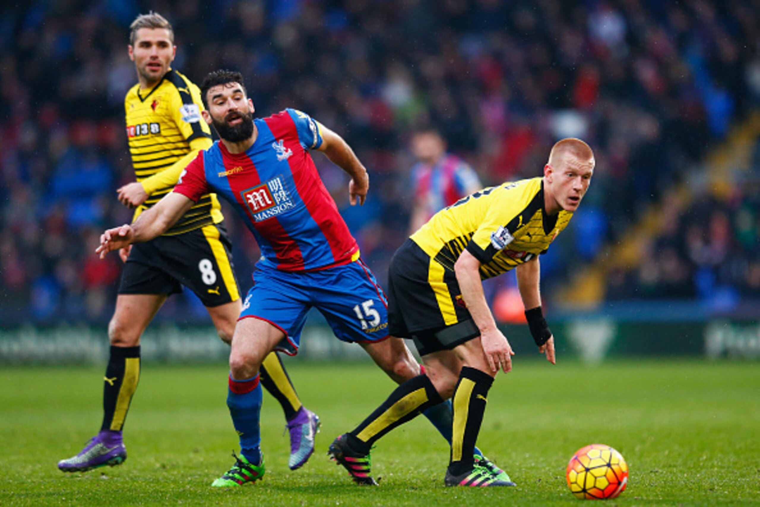 LONDON, ENGLAND - FEBRUARY 13: Ben Watson of Watford and Mile Jedinak of Crystal Palace compete for the ball during the Barclays Premier League match between Crystal Palace and Watford at Selhurst Park on February 13, 2016 in London, England.  (Photo by J