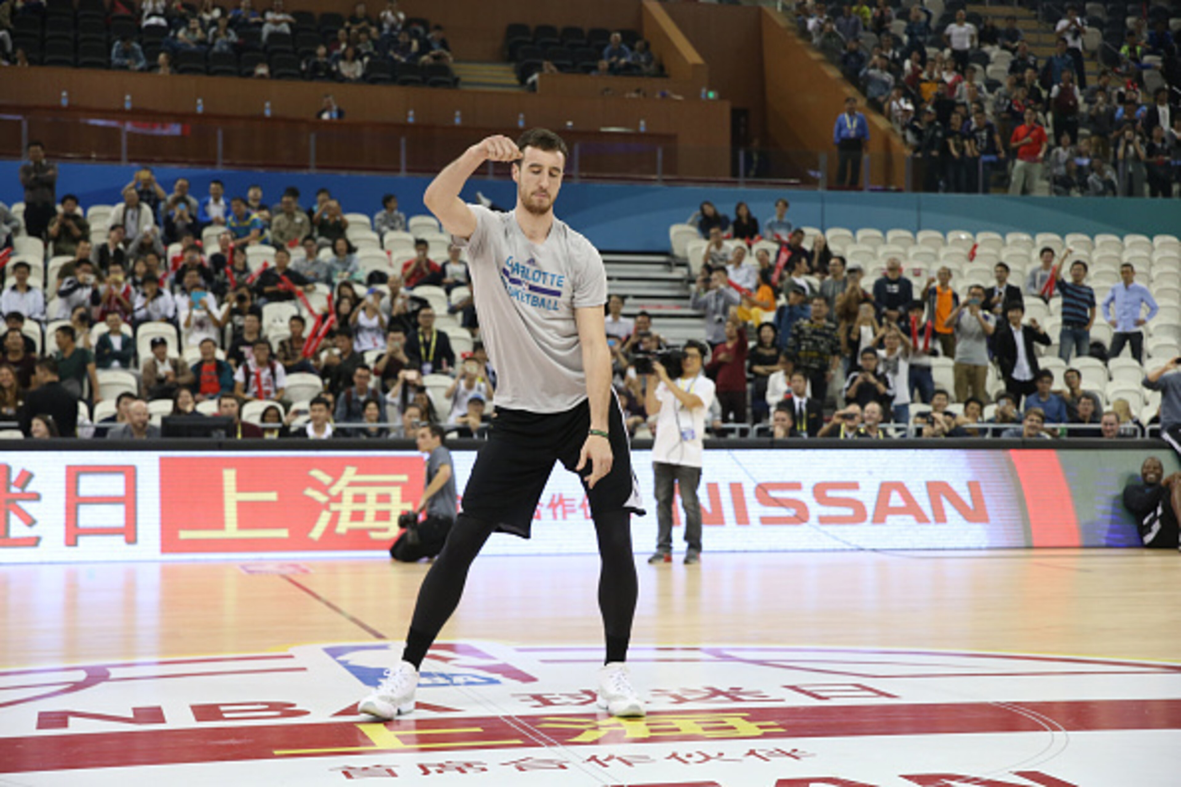 SHANGHAI, CN - OCTOBER 13: Frank Kaminsky of the Charlotte Hornets dances during Fan Appreciation Day as part of the 2015 NBA Global Games China at the Oriental Sports Center on October 13, 2015 in Shanghai, China. NOTE TO USER: User expressly acknowledge SHANGHAI, CN - OCTOBER 13: Frank Kaminsky of the Charlotte Hornets dances during Fan Appreciation Day as part of the 2015 NBA Global Games China at the Oriental Sports Center on October 13, 2015 in Shanghai, China. NOTE TO USER: User expressly acknowledge