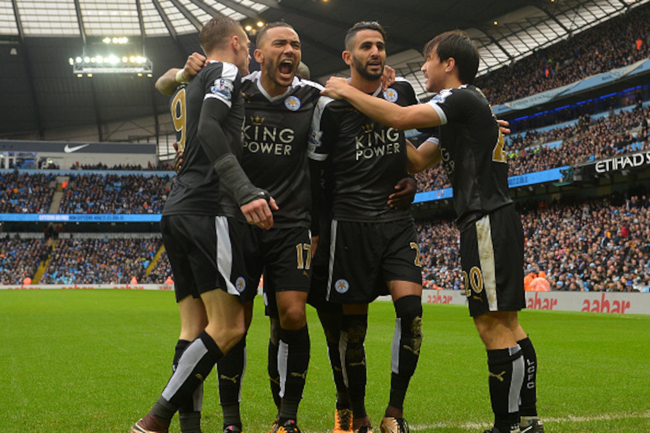 MANCHESTER, ENGLAND - FEBRUARY 06:  Riyad Mahrez (2nd R) of Leicester City celebrates scoring his team's second goal with his team mates Shinji Okazaki (1st R), Danny Simpson (2nd L) and Jamie Vardy (1st L) during the Barclays Premier League match between