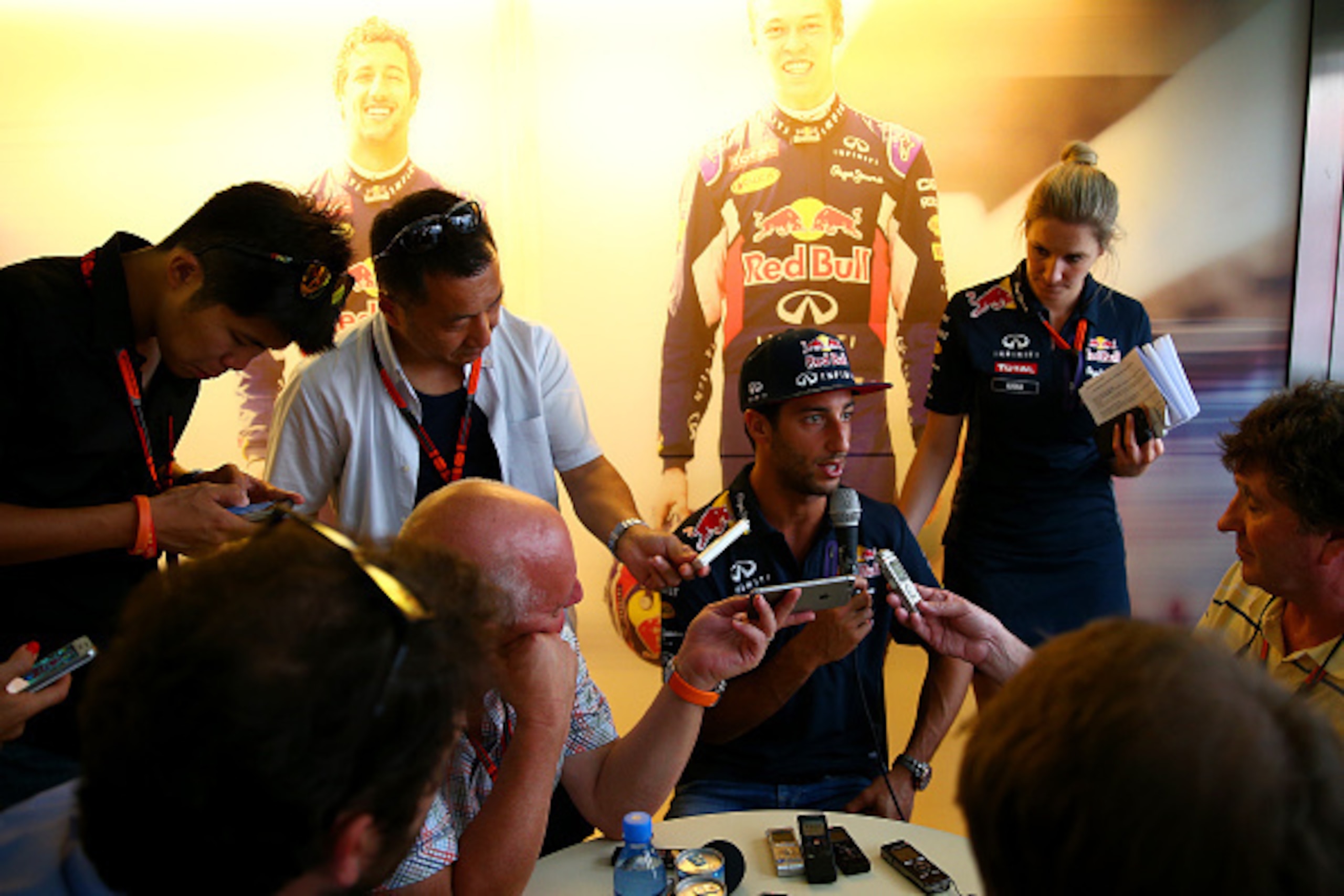 BUDAPEST, HUNGARY - JULY 23:  Daniel Ricciardo of Australia and Infiniti Red Bull Racing speaks with members of the media in the team hospitality unit during previews to the Formula One Grand Prix of Hungary at Hungaroring on July 23, 2015 in Budapest, Hu
