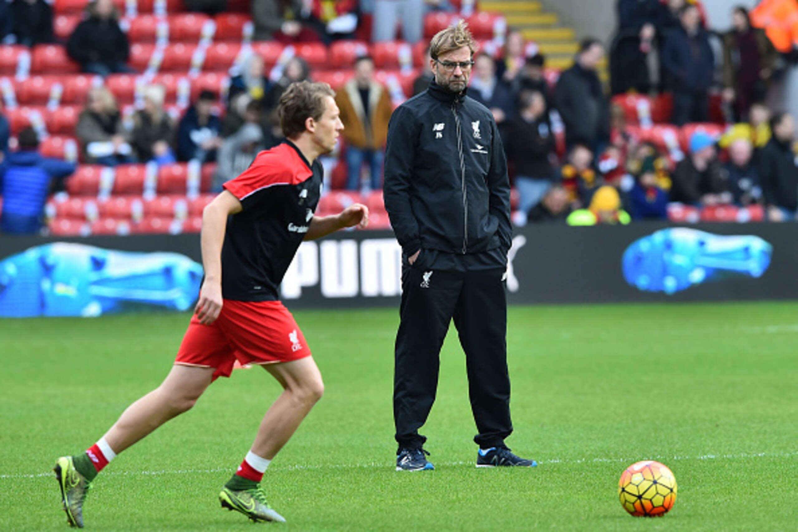 Liverpool's German manager Jurgen Klopp (R) looks on as Liverpool's Brazilian midfielder Lucas Leiva warms up ahead of the English Premier League football match between Watford and Liverpool at Vicarage Road Stadium in Watford, north of London on December Liverpool's German manager Jurgen Klopp (R) looks on as Liverpool's Brazilian midfielder Lucas Leiva warms up ahead of the English Premier League football match between Watford and Liverpool at Vicarage Road Stadium in Watford, north of London on December