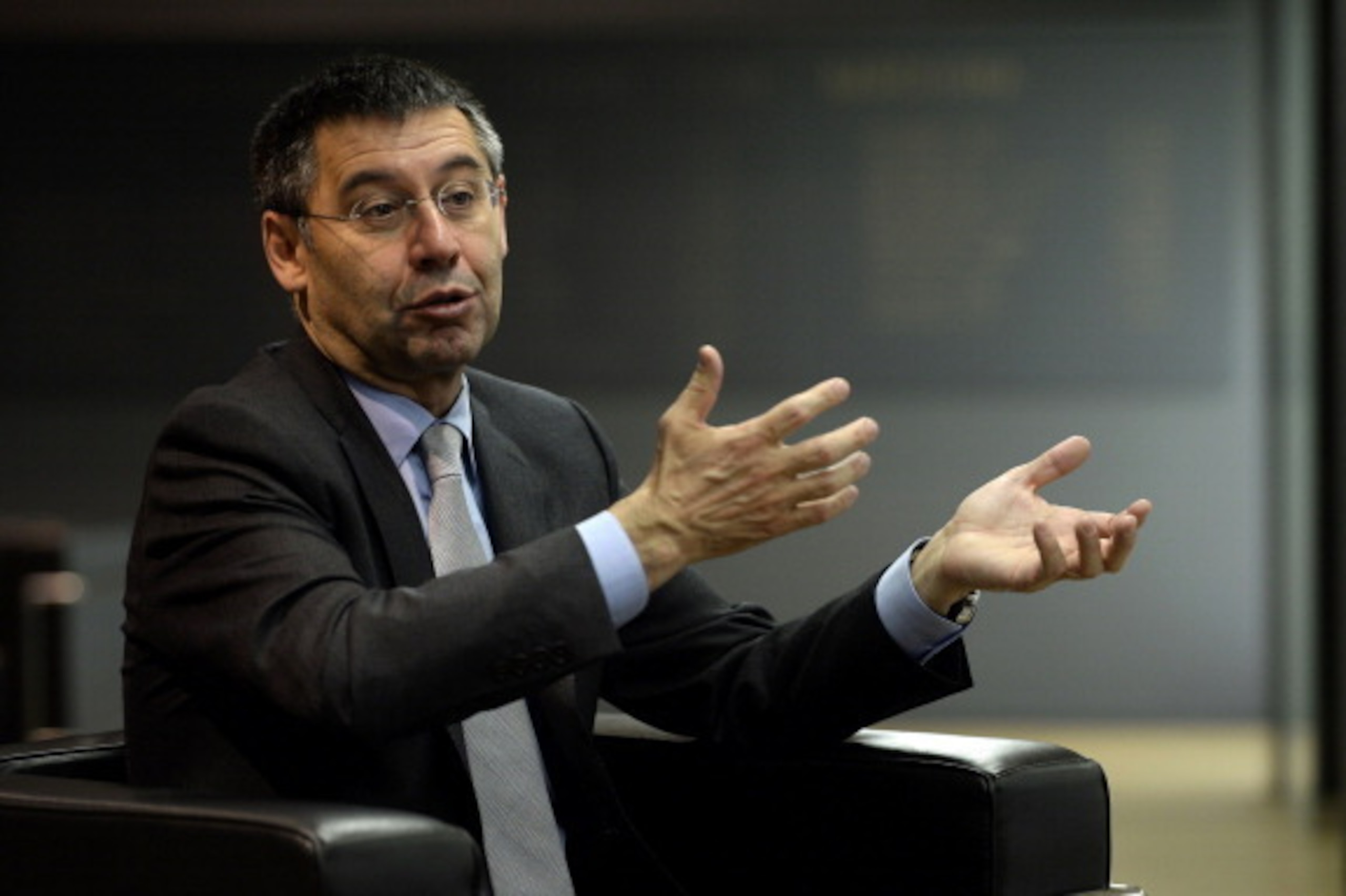 FC Barcelona's president Josep Maria Bartomeu answers to AFP journalists during an interview at Camp Nou stadium in Barcelona on March 24, 2014. Bartomeu has insisted that Lionel Messi will become the world's highest paid footballer once negotiations over
