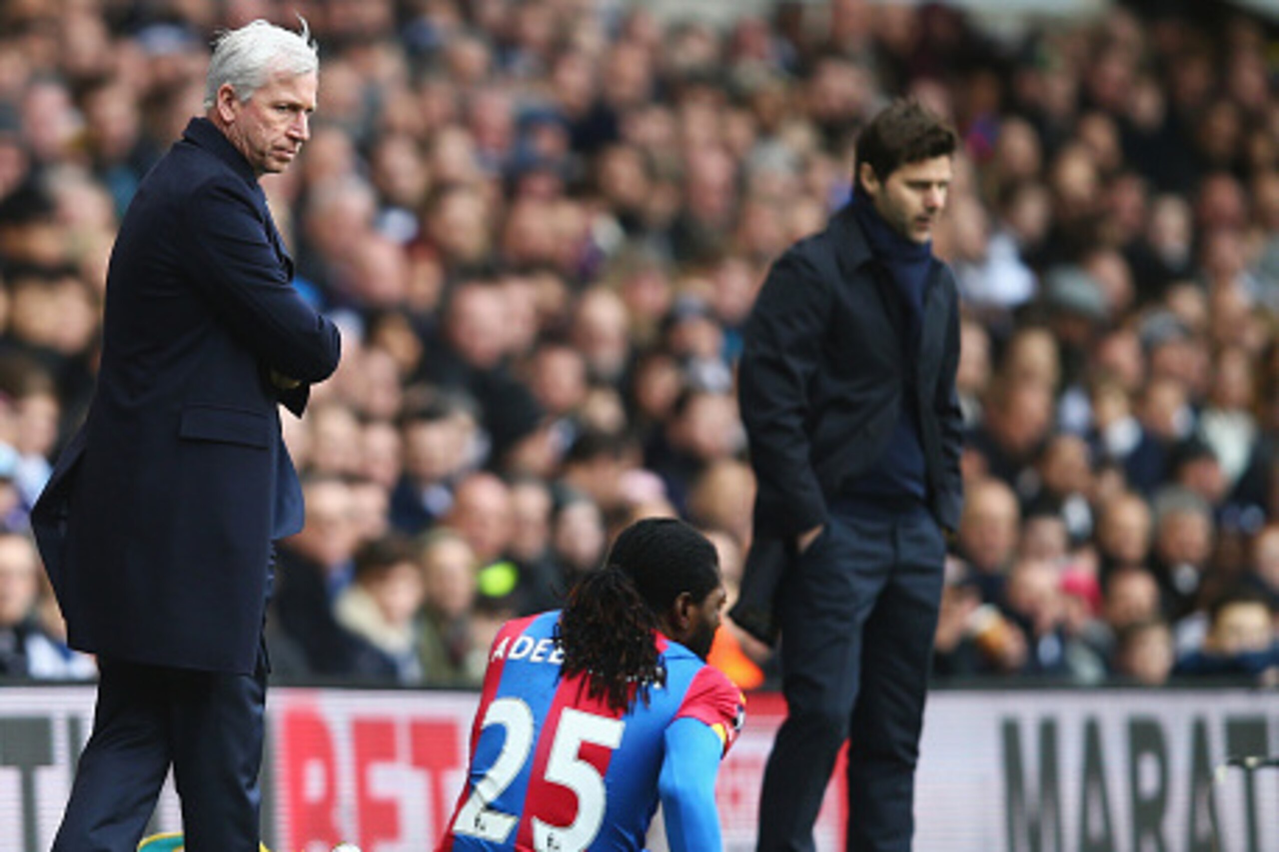 LONDON, ENGLAND - FEBRUARY 21:  Alan Pardew, Manager of Crystal Palace talks to Emmanuel Adebayor of Crystal Palace with Mauricio Pochettino, Manager of Tottenham Hotspur during the Emirates FA Cup Fifth Round match between Tottenham Hotspur and Crystal P