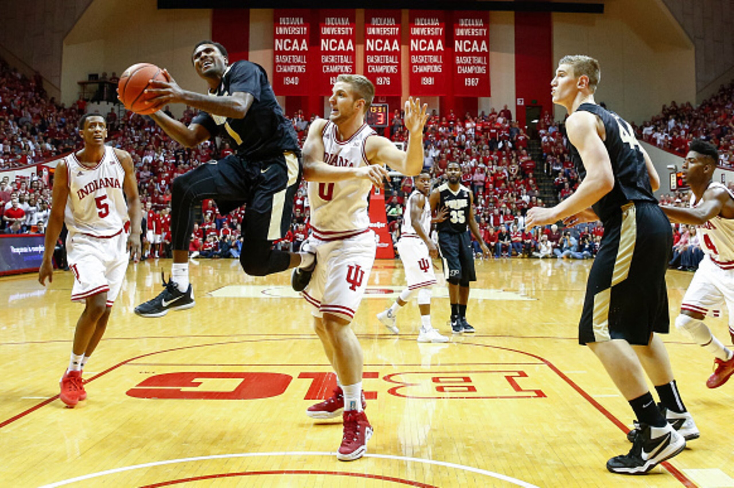 BLOOMINGTON, IN - FEBRUARY 20: Johnny Hill #1 of the Purdue Boilermakers takes the ball to the hoops against Max Bielfeldt #0 of the Indiana Hoosiers at Assembly Hall on February 20, 2016 in Bloomington, Indiana. Indiana defeated Purdue 77-73. (Photo by M BLOOMINGTON, IN - FEBRUARY 20: Johnny Hill #1 of the Purdue Boilermakers takes the ball to the hoops against Max Bielfeldt #0 of the Indiana Hoosiers at Assembly Hall on February 20, 2016 in Bloomington, Indiana. Indiana defeated Purdue 77-73. (Photo by M