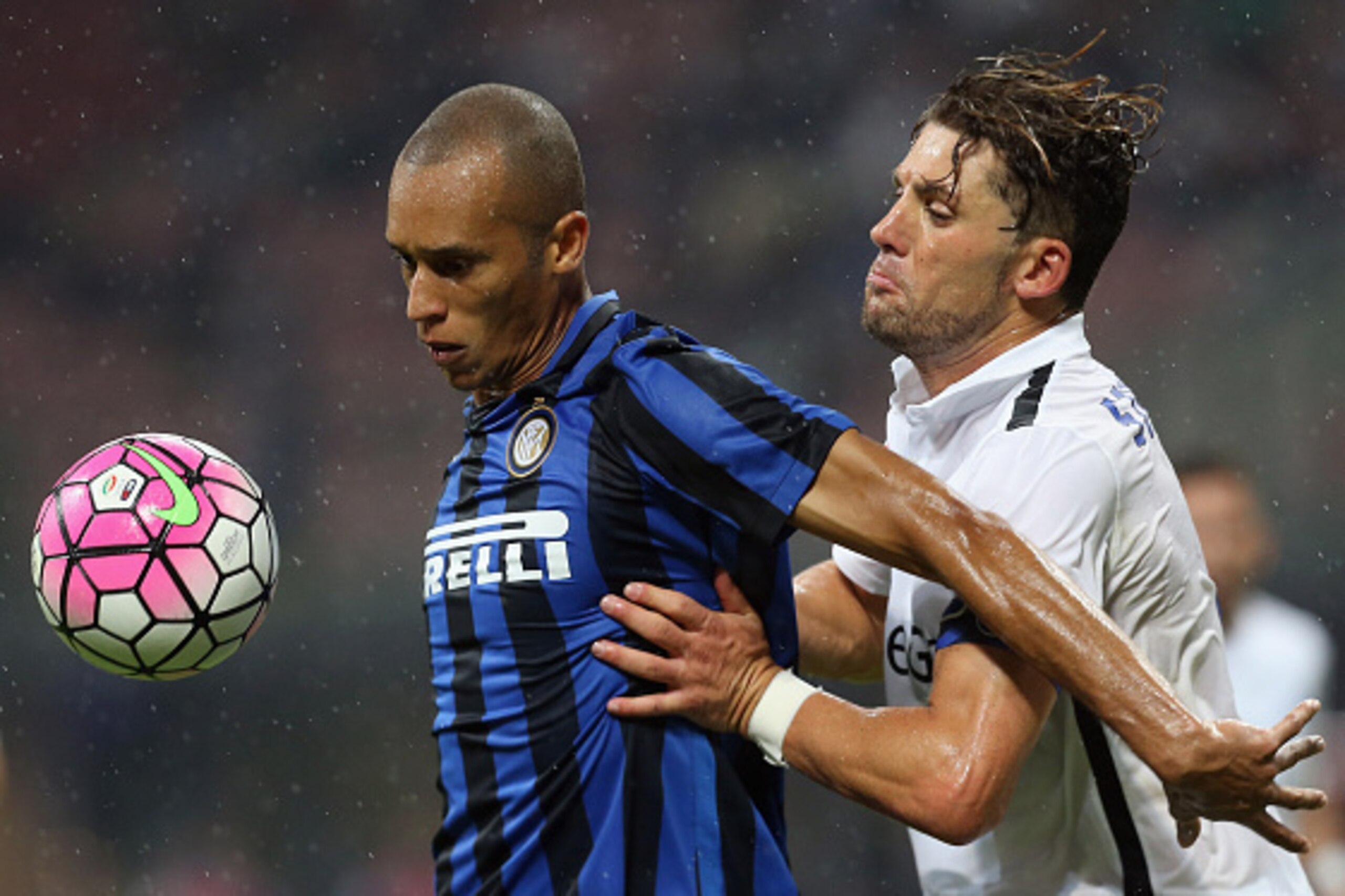 MILAN, ITALY - AUGUST 23: Joao Miranda (L) of Inter competes for the ball with Guglielmo Stendardo of Atalanta during the Serie A match between FC Internazionale Milano and Atalanta BC at Stadio Giuseppe Meazza on August 23, 2015 in Milan, Italy. (Photo MILAN, ITALY - AUGUST 23: Joao Miranda (L) of Inter competes for the ball with Guglielmo Stendardo of Atalanta during the Serie A match between FC Internazionale Milano and Atalanta BC at Stadio Giuseppe Meazza on August 23, 2015 in Milan, Italy. (Photo