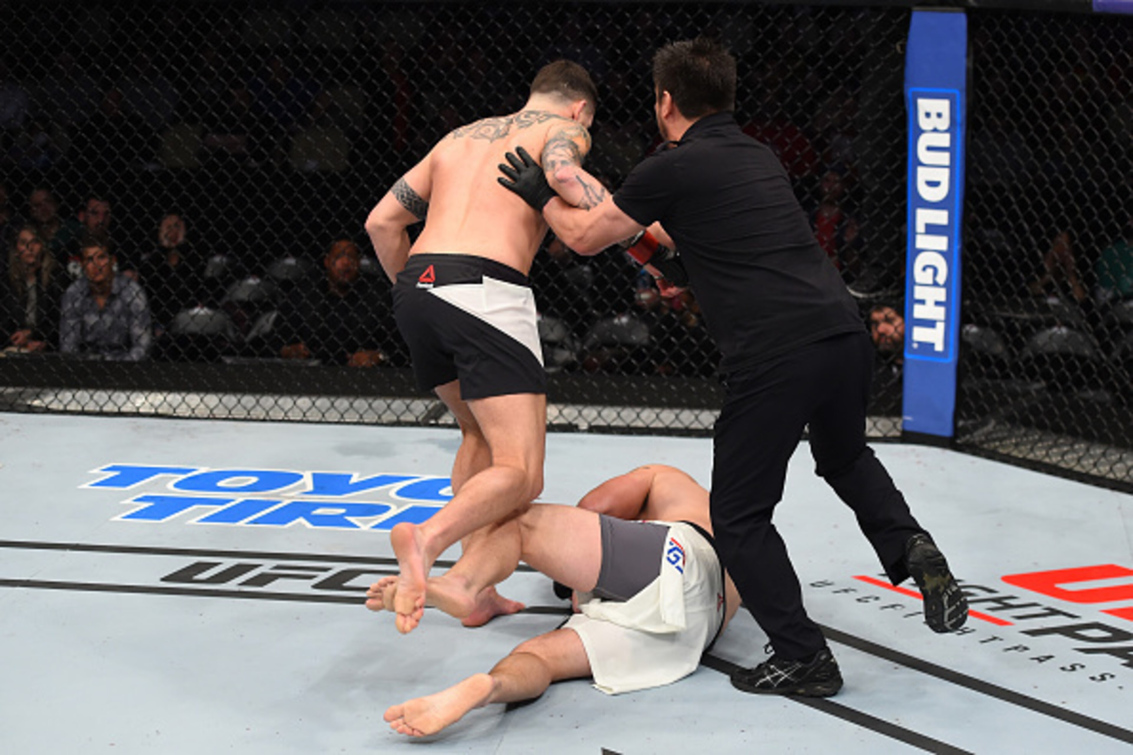 PITTSBURGH, PA - FEBRUARY 21:  (L-R) Chris Camozzi knocks out Joe Riggs in their middleweight bout during the UFC Fight Night event at Consol Energy Center on February 21, 2016 in Pittsburgh, Pennsylvania. (Photo by Jeff Bottari/Zuffa LLC/Zuffa LLC via Ge