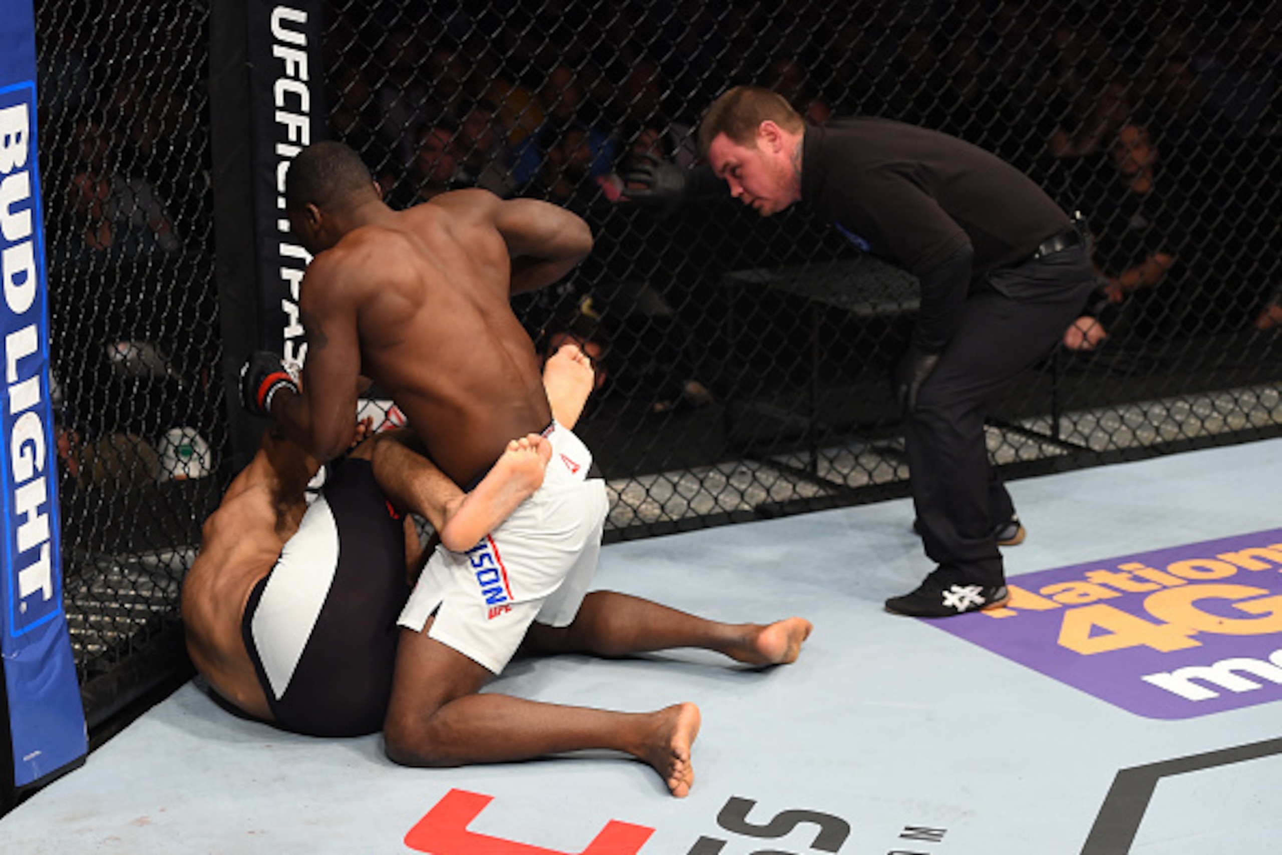 PITTSBURGH, PA - FEBRUARY 21:  Derek Brunson (top) punches Roan Carneiro in their middleweight bout during the UFC Fight Night event at Consol Energy Center on February 21, 2016 in Pittsburgh, Pennsylvania. (Photo by Jeff Bottari/Zuffa LLC/Zuffa LLC via G