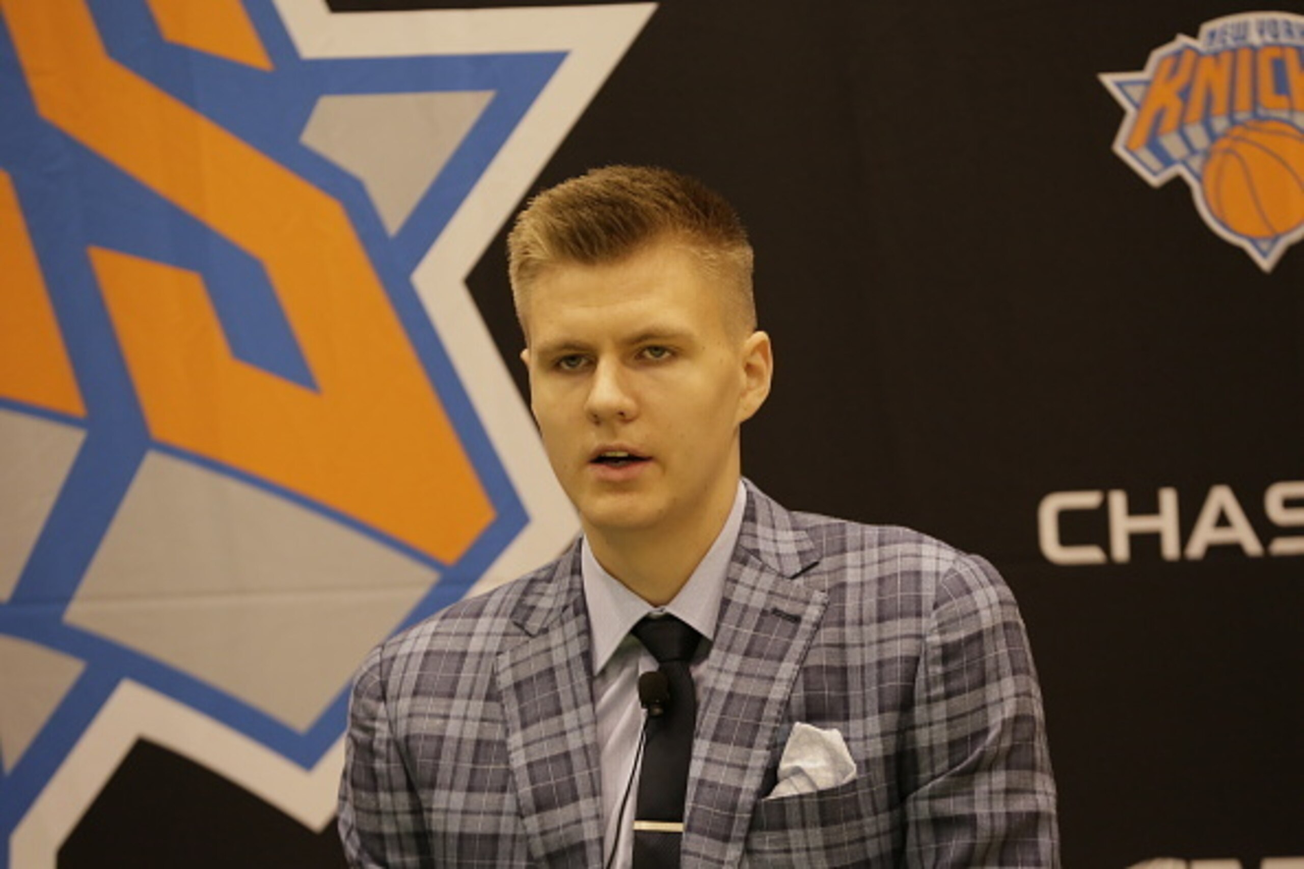 TARRYTOWN, NY - JUNE 26: Kristaps Porzingis, first round Draft pick of the New York Knicks speaks to the media at the Madison Square Garden Training Facility on June 26, 2015 in Tarrytown, New York. NOTE TO USER: User expressly acknowledges and agrees tha TARRYTOWN, NY - JUNE 26: Kristaps Porzingis, first round Draft pick of the New York Knicks speaks to the media at the Madison Square Garden Training Facility on June 26, 2015 in Tarrytown, New York. NOTE TO USER: User expressly acknowledges and agrees tha