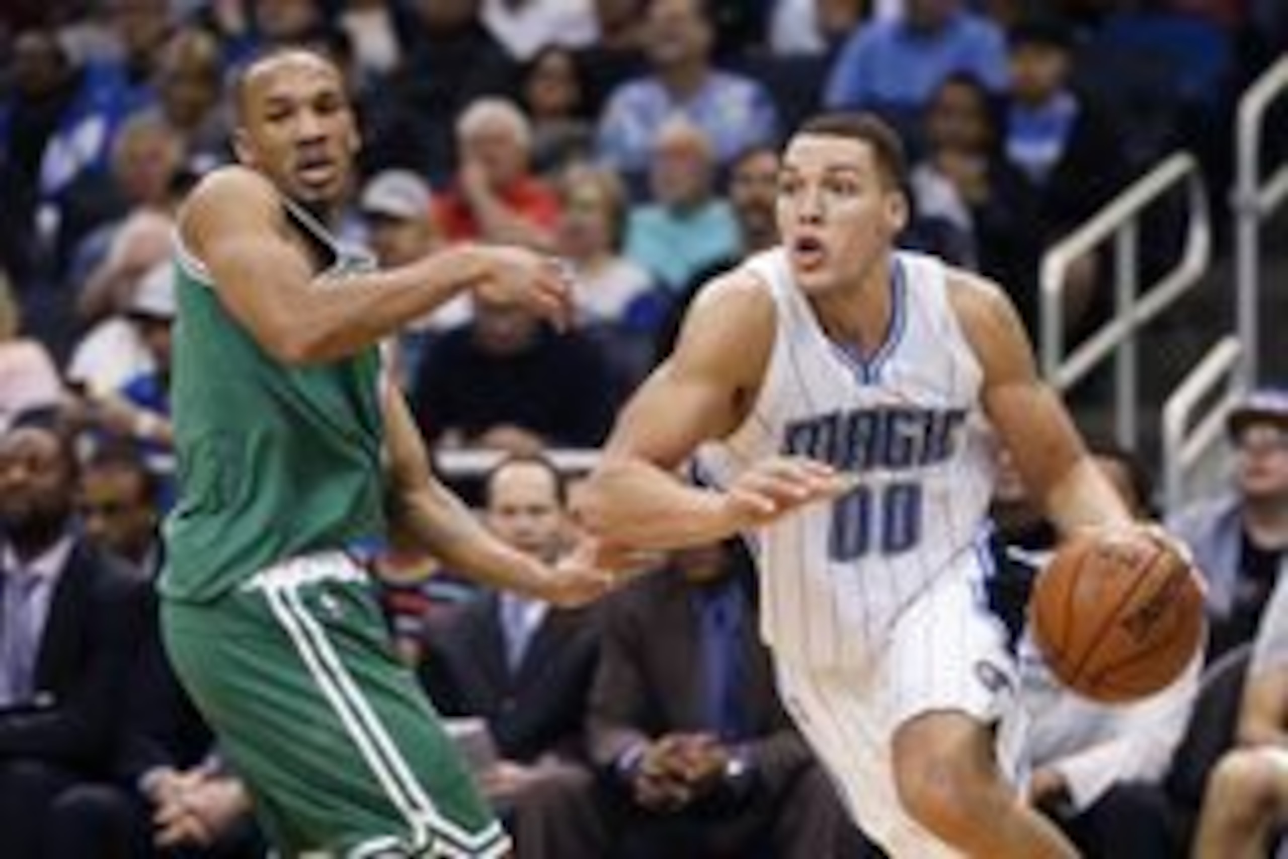 Jan 31, 2016; Orlando, FL, USA; Orlando Magic forward Aaron Gordon (00) drives past Boston Celtics guard Avery Bradley (0) during the second half of a basketball game at Amway Center. The Magic won 119-114. Mandatory Credit: Reinhold Matay-USA TODAY Sport