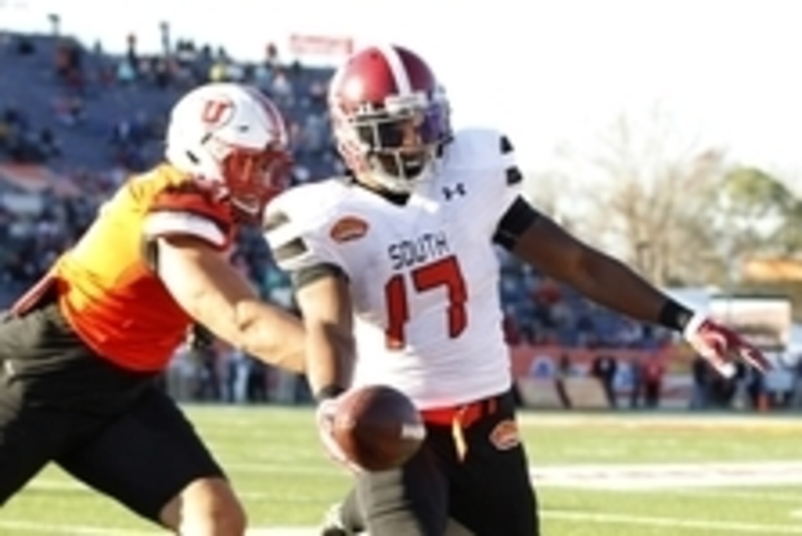 Jan 30, 2016; Mobile, AL, USA; South squad running back Kenyan Drake of Alabama (17) carries the ball in for a touchdown around North squad defensive end Jason Fanaika of Utah (71) during second half of the Senior Bowl at Ladd-Peebles Stadium. Mandatory C