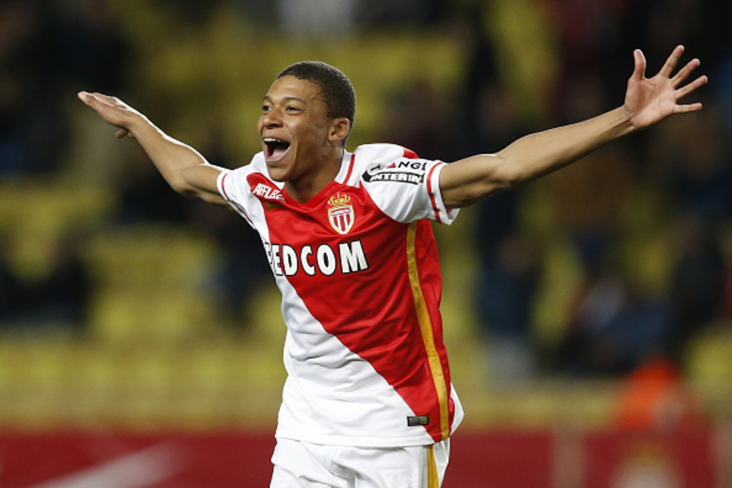 Monaco's French forward Kylian Mbappe Lottin celebrates after scoring a goal during the French L1 football match Monaco (ASM) vs Troyes (ESTAC) on February 20, 2016 at the 'Louis II Stadium' in Monaco. AFP PHOTO / VALERY HACHE / AFP / VALERY HACHE Monaco's French forward Kylian Mbappe Lottin celebrates after scoring a goal during the French L1 football match Monaco (ASM) vs Troyes (ESTAC) on February 20, 2016 at the 'Louis II Stadium' in Monaco. AFP PHOTO / VALERY HACHE / AFP / VALERY HACHE