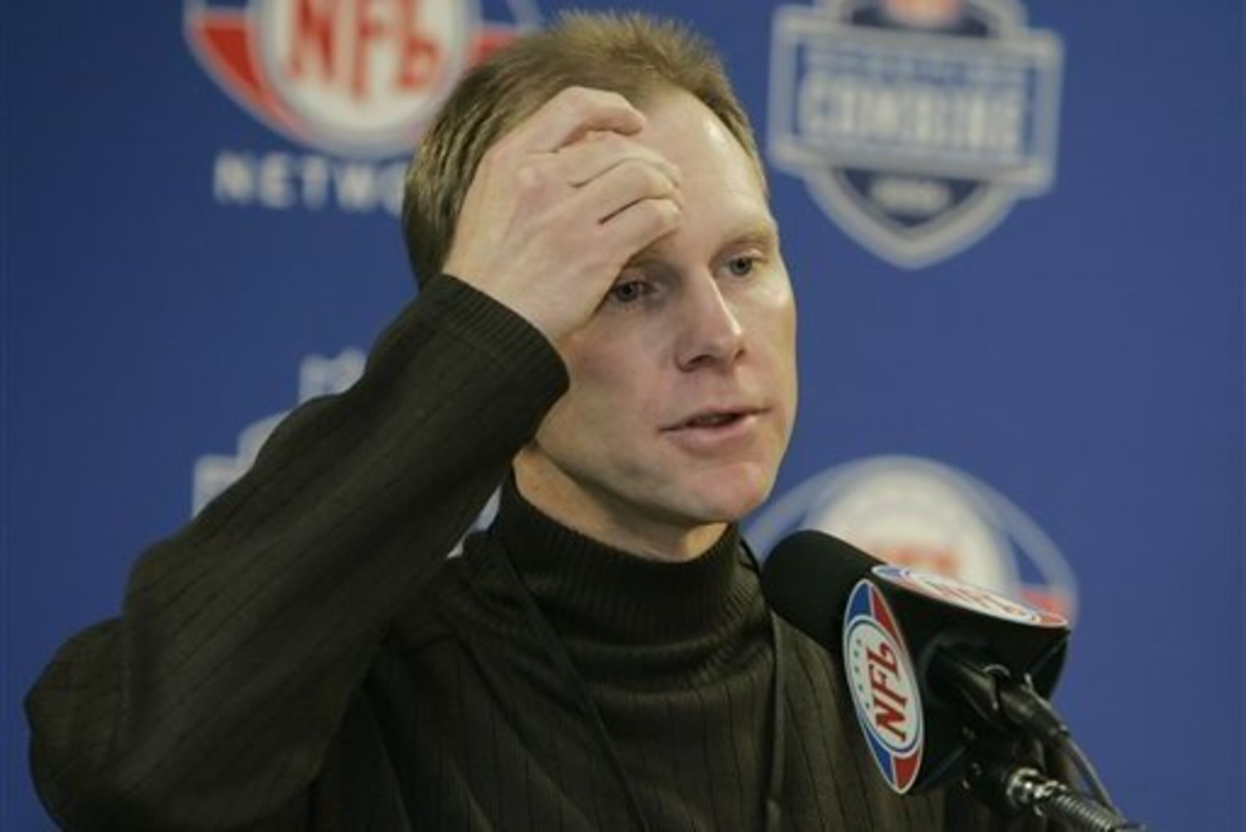 Phil Savage talks to the media at a previous combine.