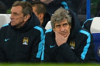 Manchester City's Chilean manager Manuel Pellegrini (C) gestures during the English FA Cup fifth round football match between Chelsea and Manchester City at Stamford Bridge in London on February 21, 2016. Chelsea won the game 5-1. / AFP / GLYN KIRK / REST