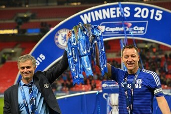 Chelsea's Portuguese manager Jose Mourinho (L) and Chelsea's captain, English defender John Terry (R) celebrate with the trophy during the presentation after Chelsea won the League Cup final football match against Tottenham Hotspur at Wembley Stadium in L