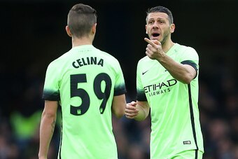 LONDON, ENGLAND - FEBRUARY 21 :  Martin Demichelis of Manchester City talks to Bersant Celina of Manchester City during the Emirates FA Cup match between Chelsea and Manchester City at Stamford Bridge on February 21, 2016 in London, England.  (Photo by Ca
