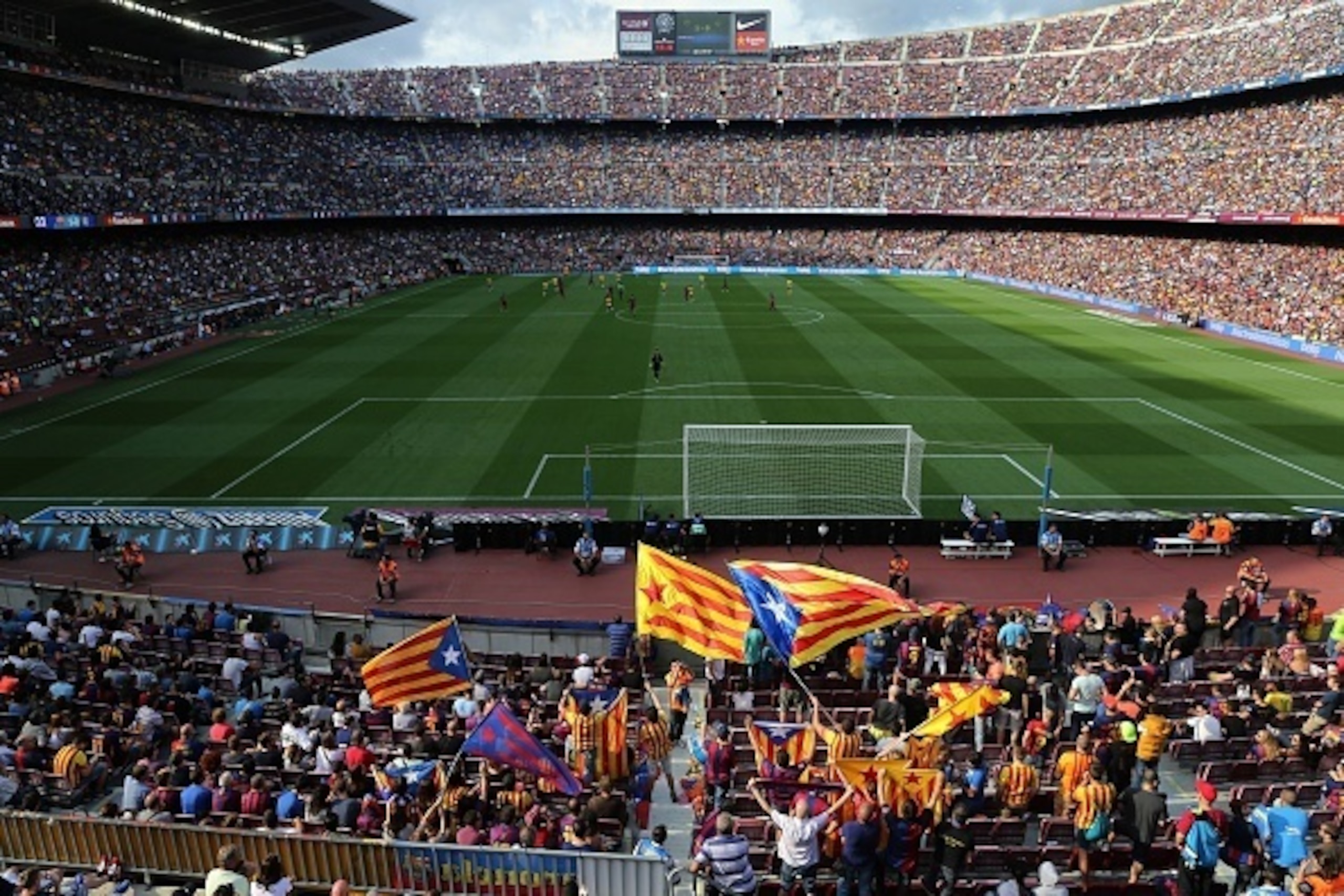 Barcelona's supporters wave 'Estelada', pro-independent Catalonia flags, during the Spanish league football match FC Barcelona vs UD Las Palmas at the Camp Nou stadium in Barcelona on September 26, 2015. AFP PHOTO / CESAR MANSO        (Photo credit should