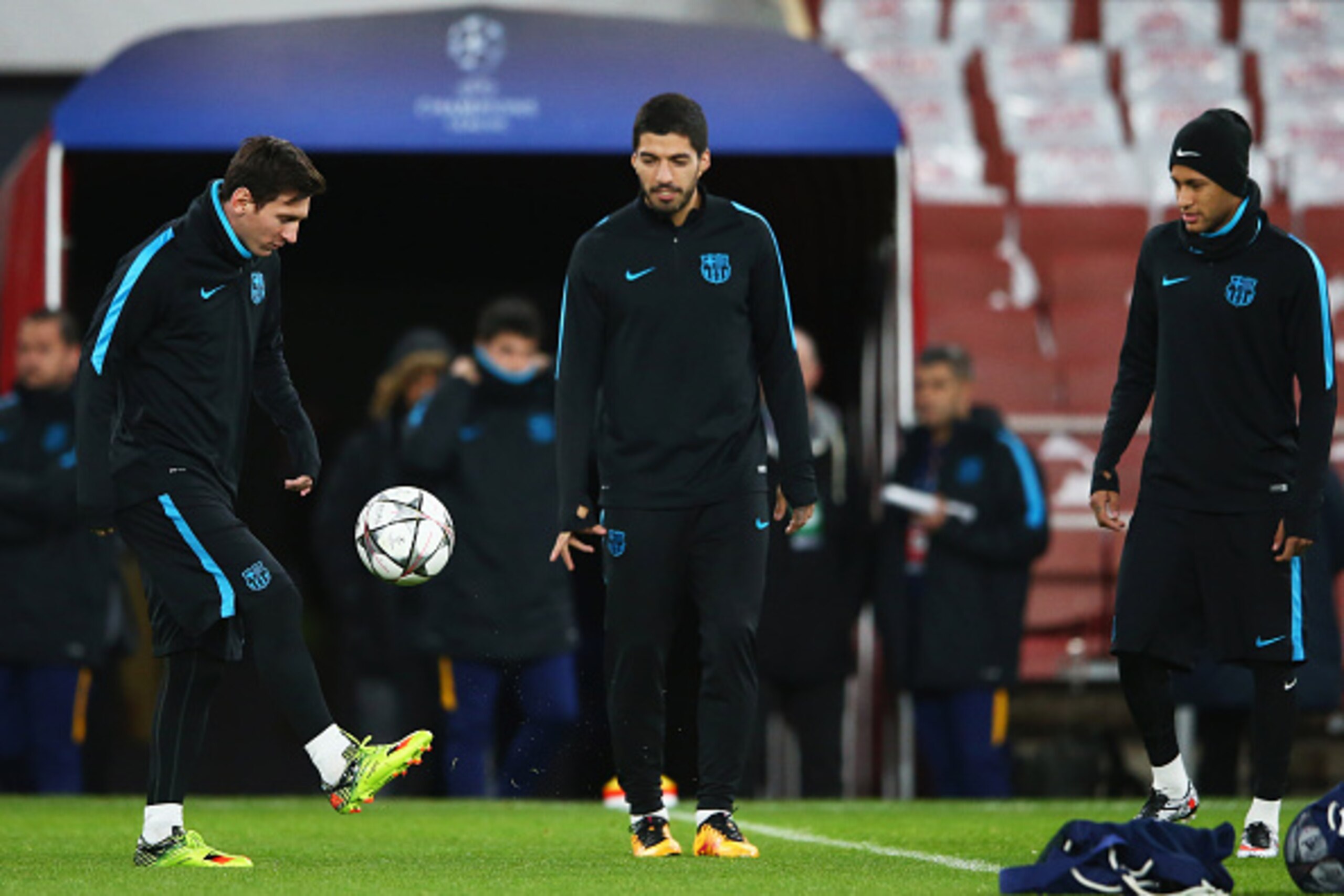 LONDON, ENGLAND - FEBRUARY 22:  Lionel Messi (L) is watched by team mates Luis Suarez (C) and Neymar (R) during a FC Barcelona training session ahead of their UEFA Champions League round of 16 first leg match against Arsenal at the Emirates Stadium on Feb